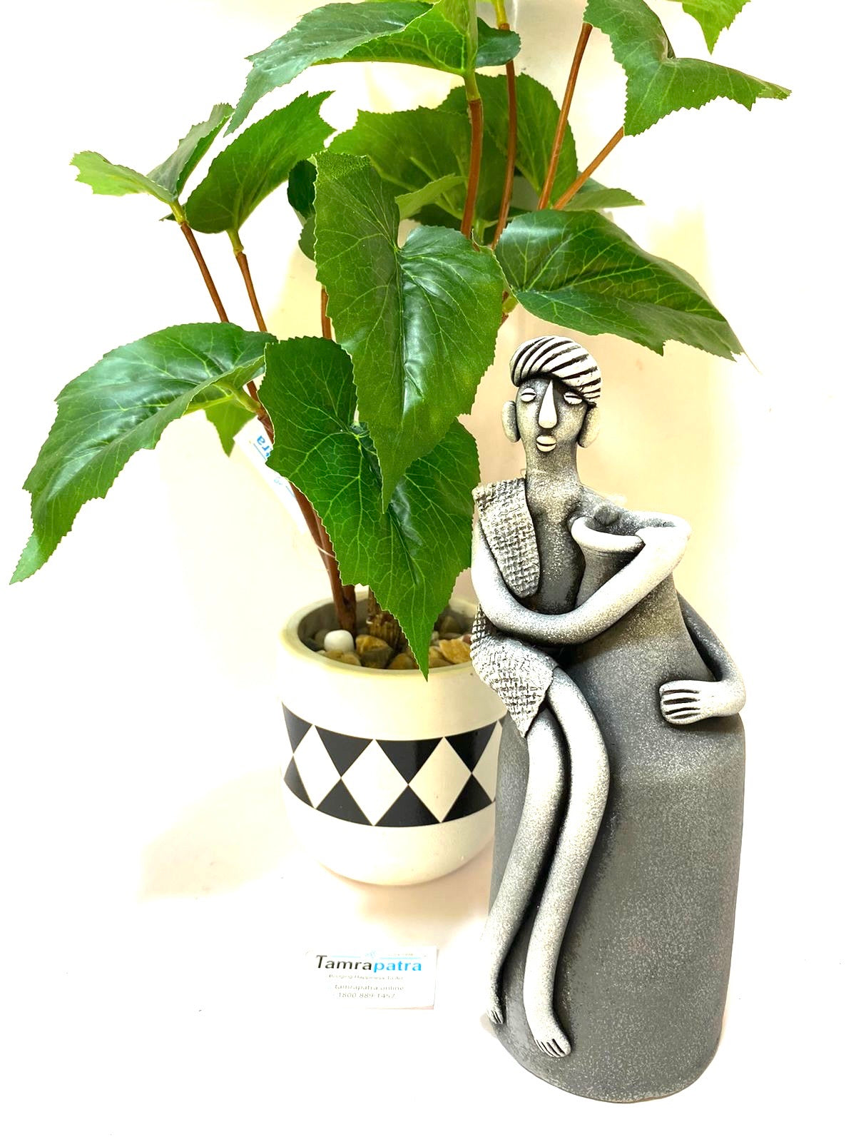 Tribal Man Sitting on Colorful Pot Exclusive Pottery Decoration By Tamrapatra - Tamrapatra