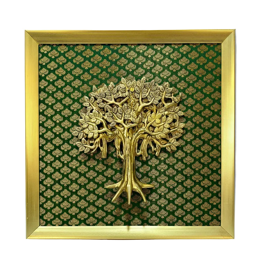 Gold tree sculpture on a green patterned background with a gold frame.