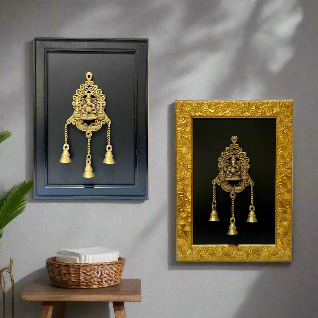 Two decorative wall hangings in black and gold frames on a white background