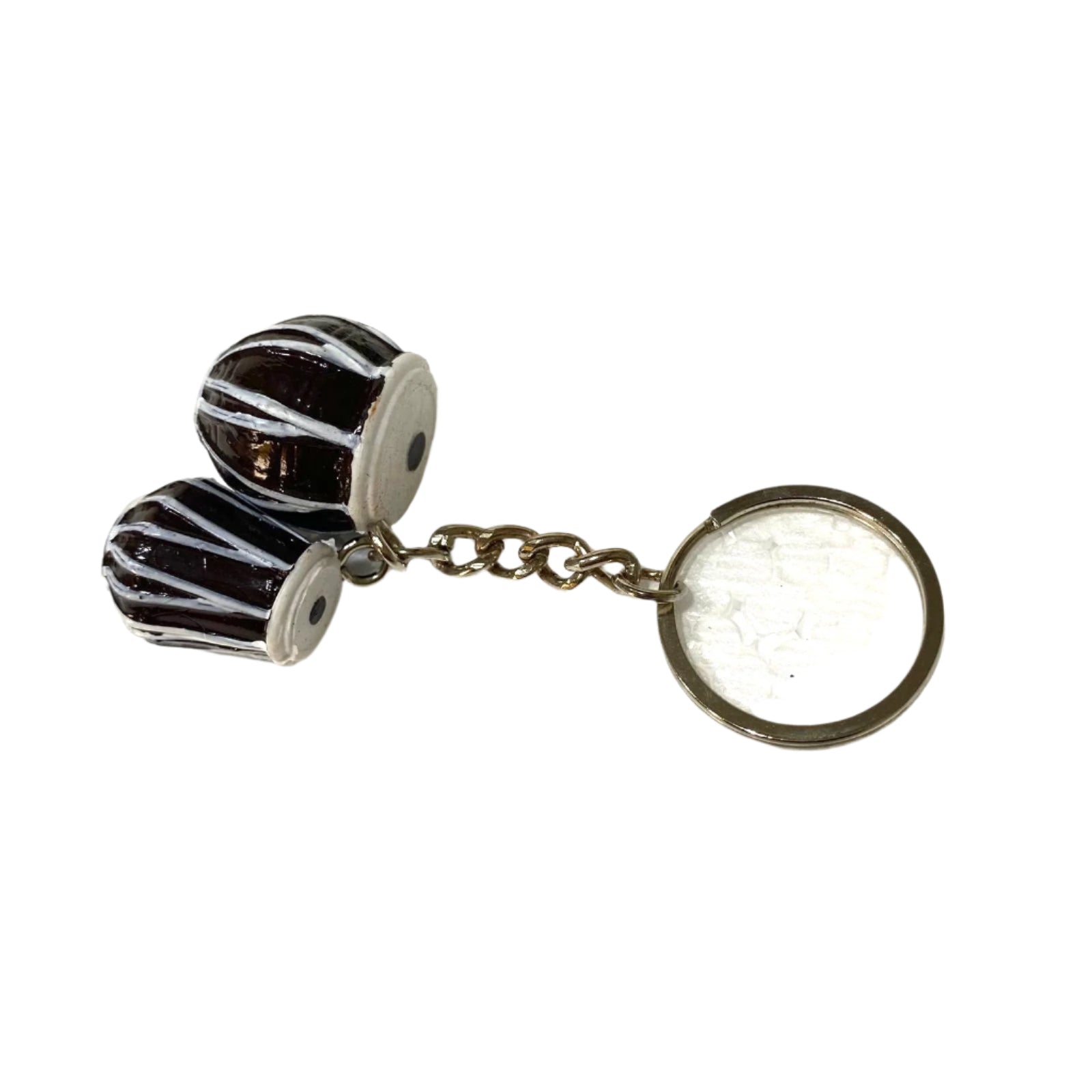 Keychain with zebra-striped design on a textured white background