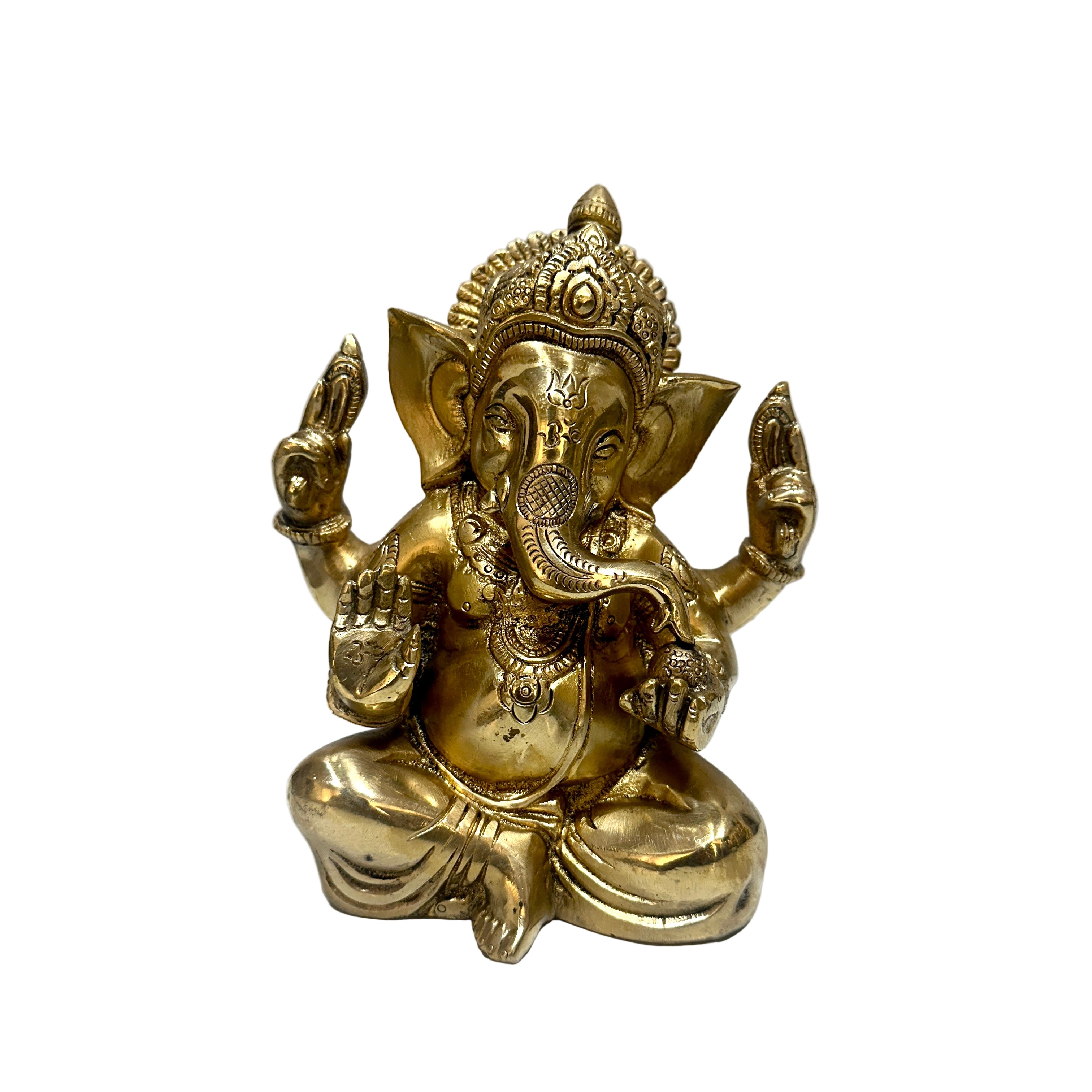 Gold-colored statue of a deity with multiple arms on a white background