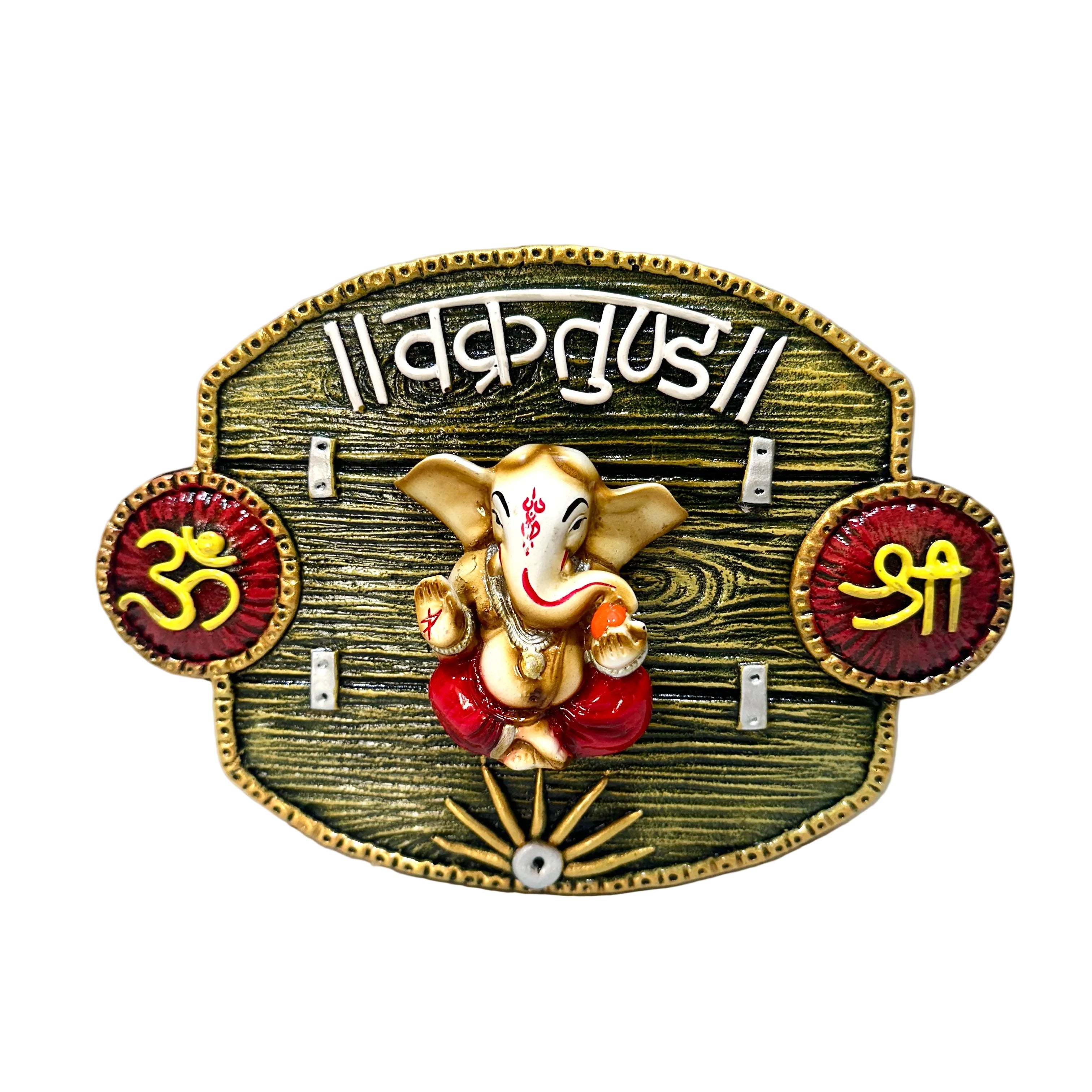 Decorative plaque with a figure of Ganesha and sacred symbols on a white background