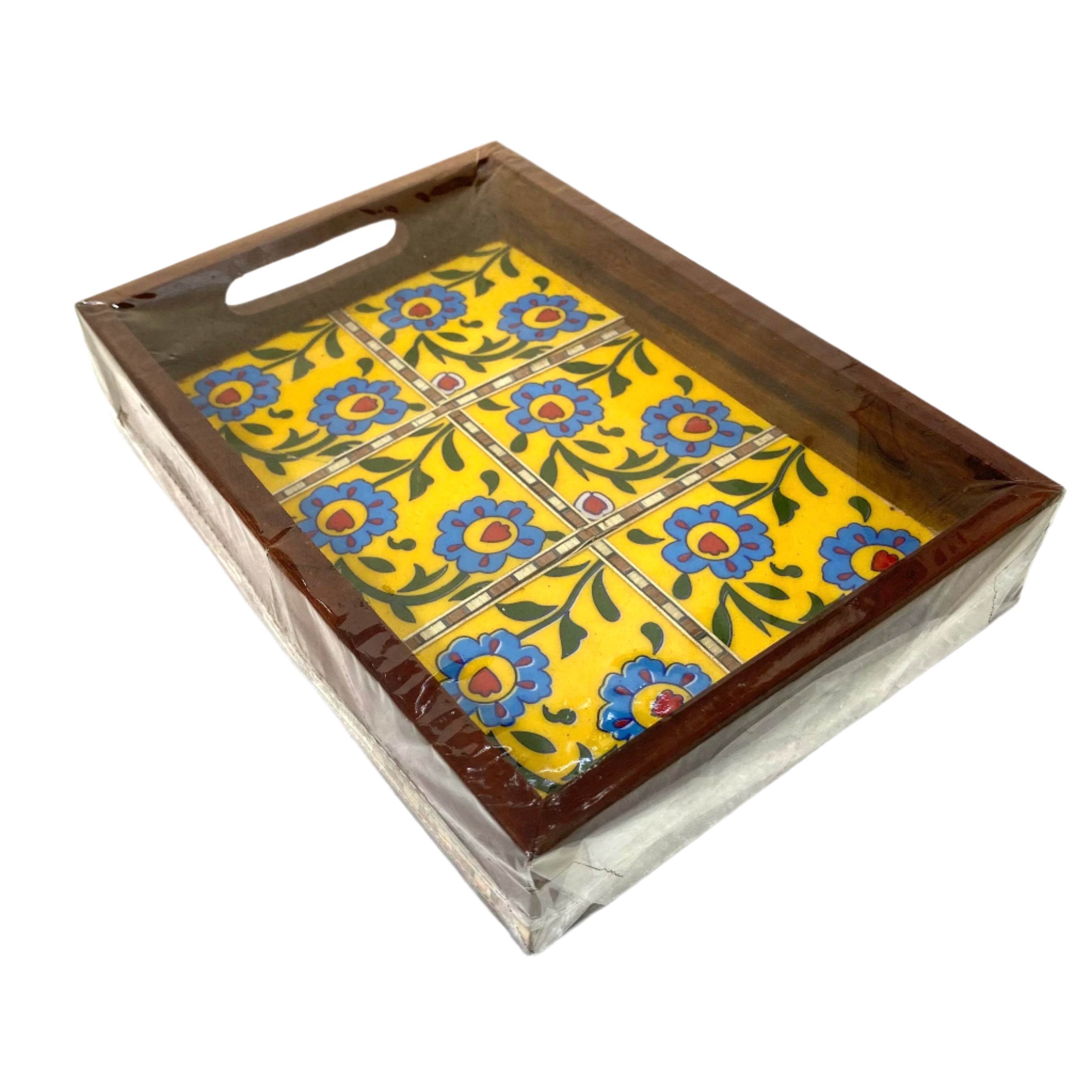 Decorative tray with floral tile design on a white background