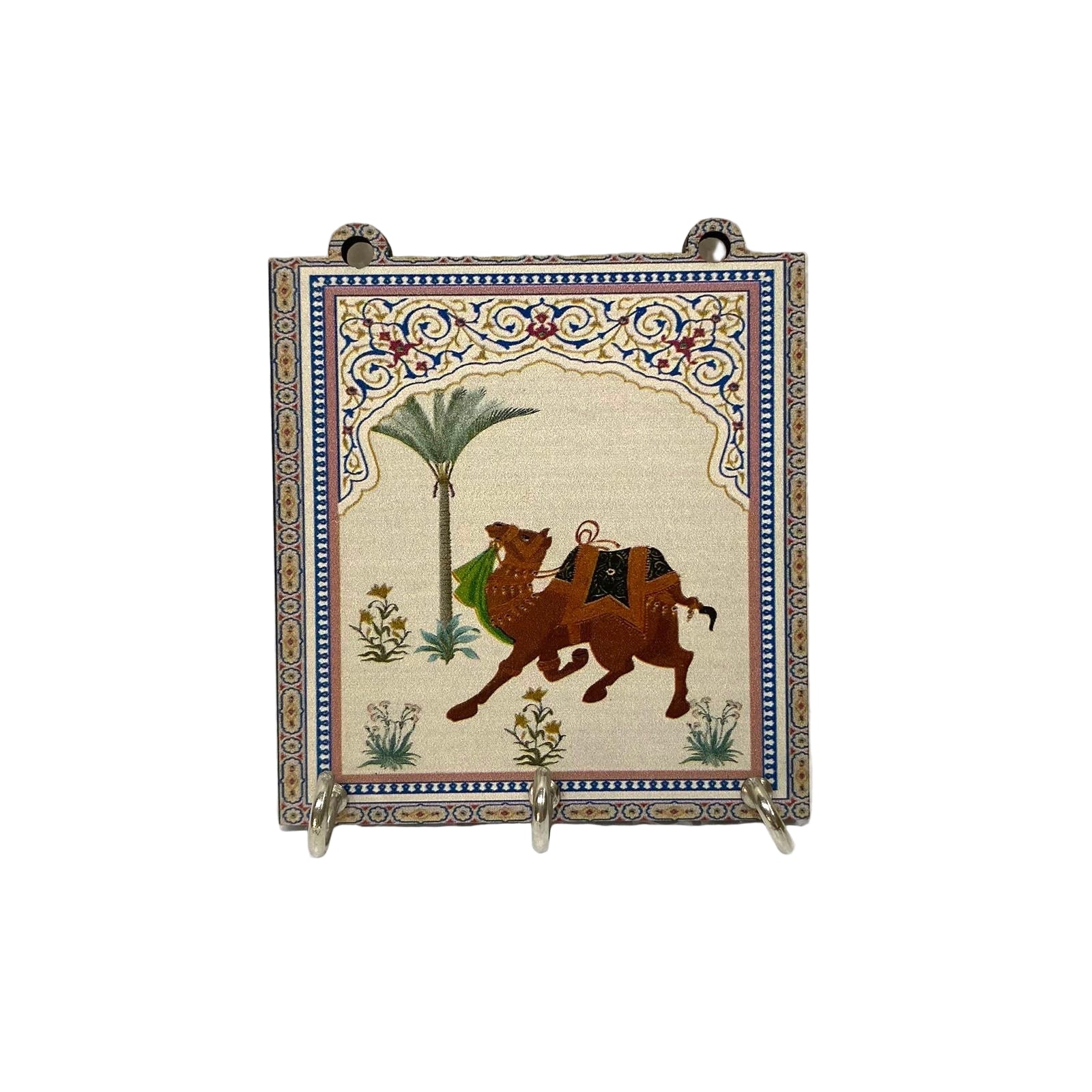 Decorative tile with a camel and palm tree design on a textured white background