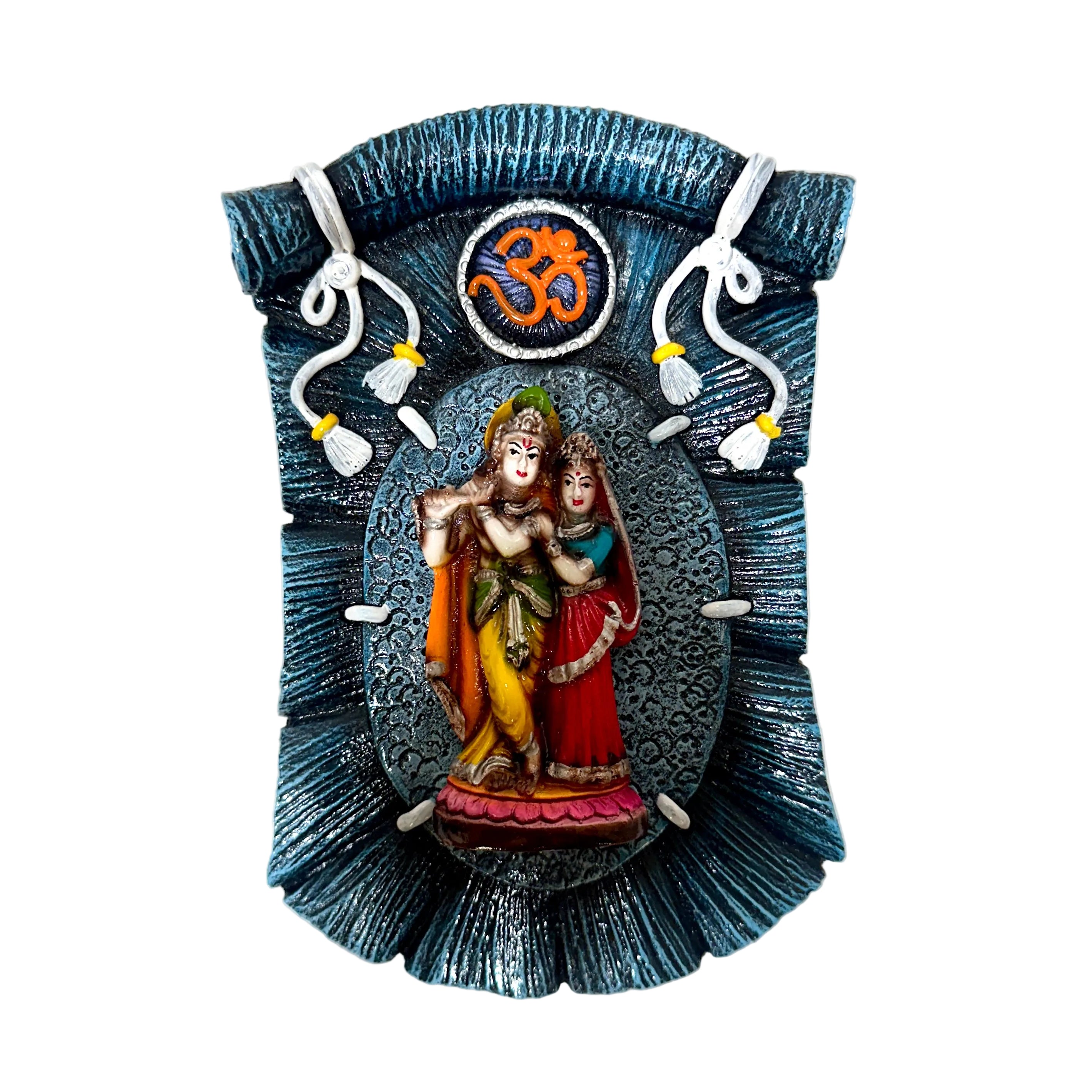 Decorative wall art with two figures and an Om symbol on a blue background