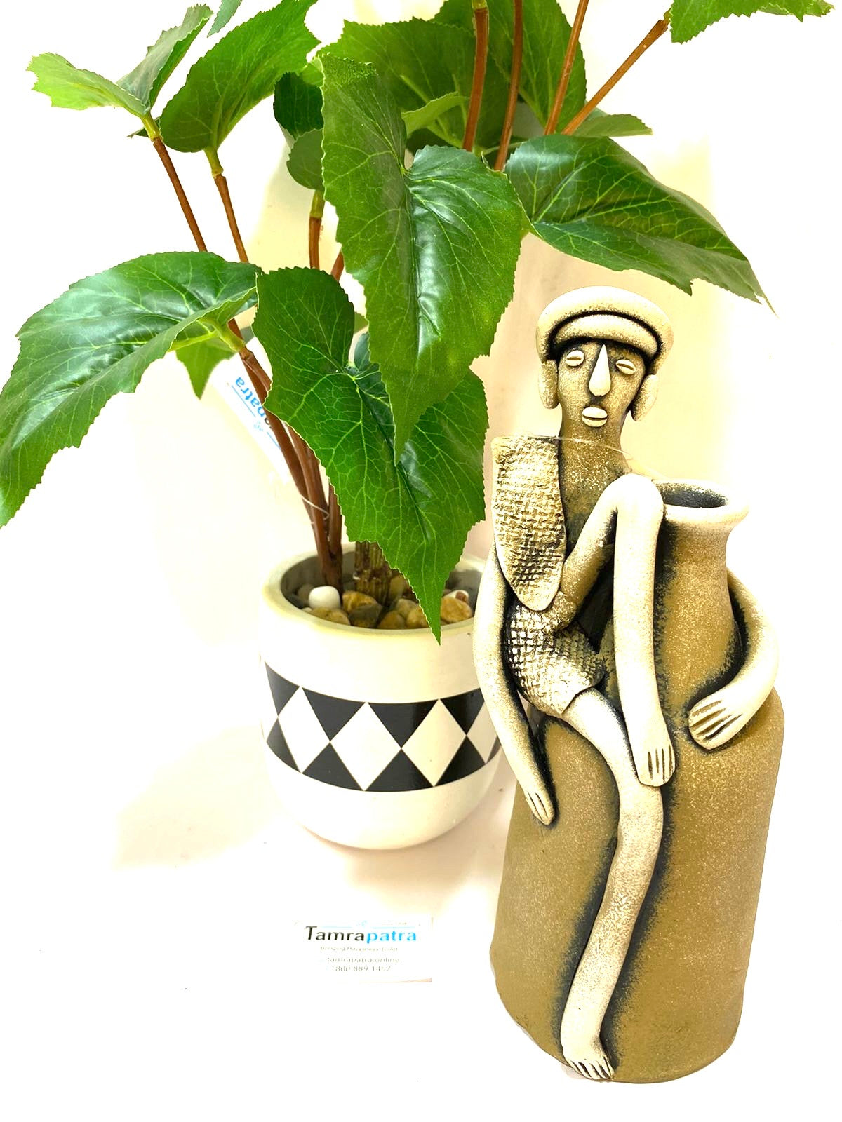 Tribal Man Sitting on Colorful Pot Exclusive Pottery Decoration By Tamrapatra - Tamrapatra