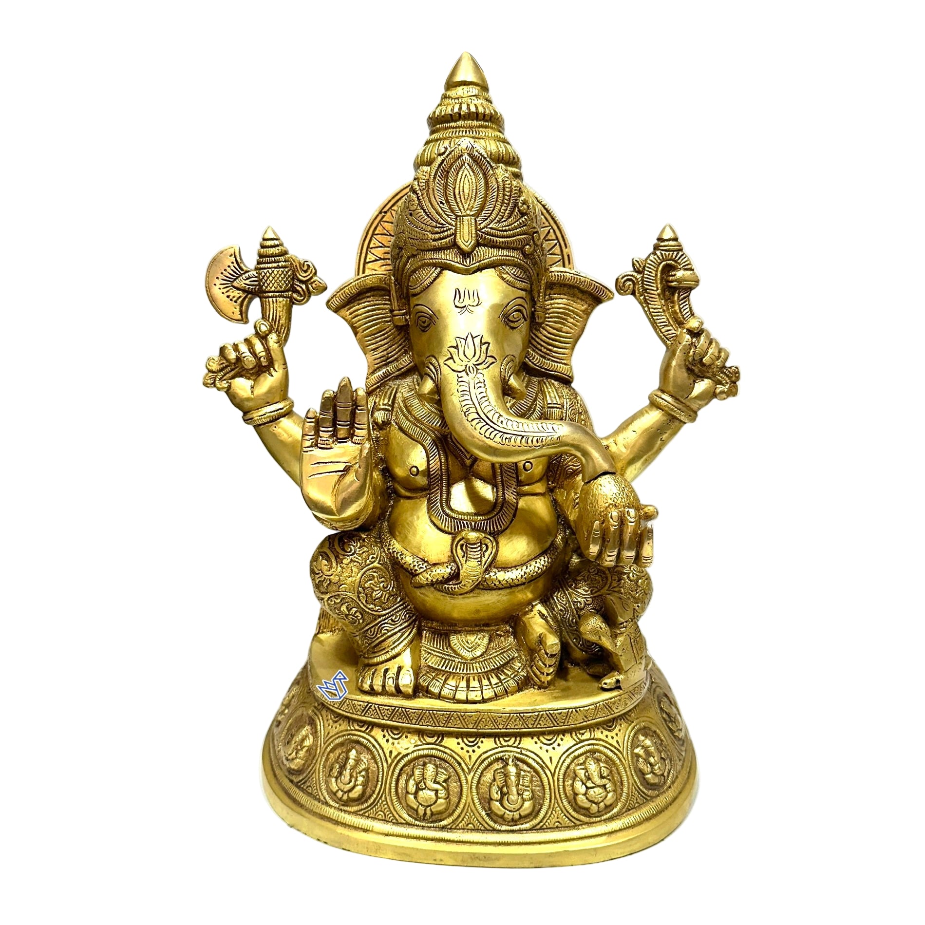 Gold-colored statue of a deity with multiple arms on a white surface.