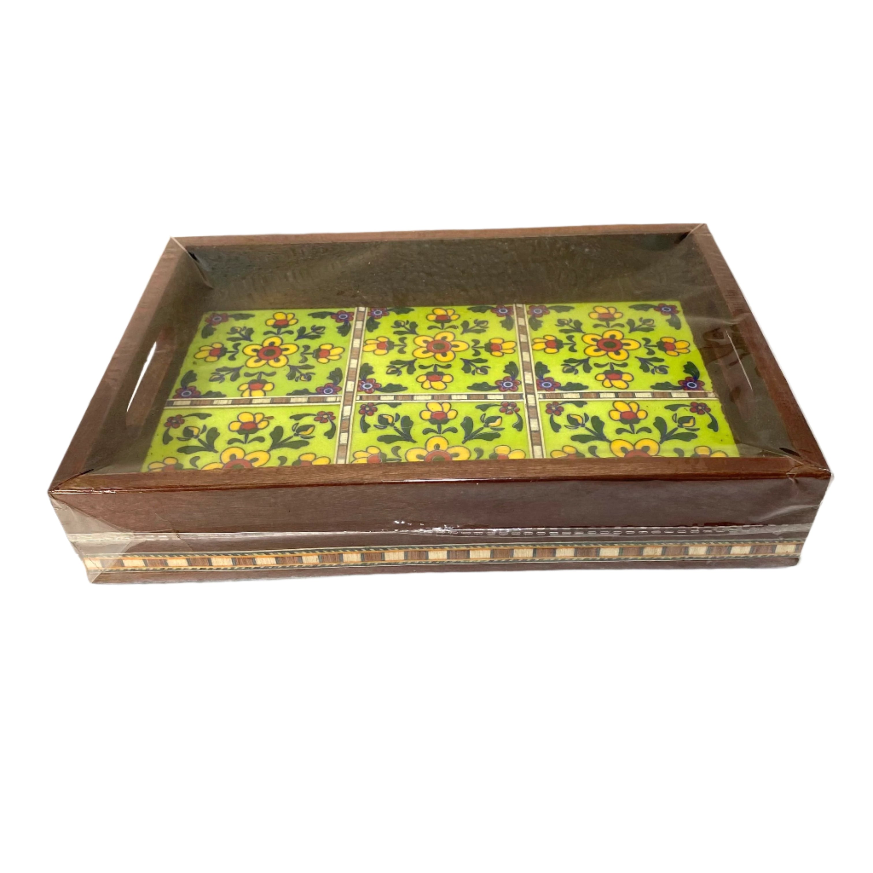 Decorative wooden box with a green floral patterned lid on a white background