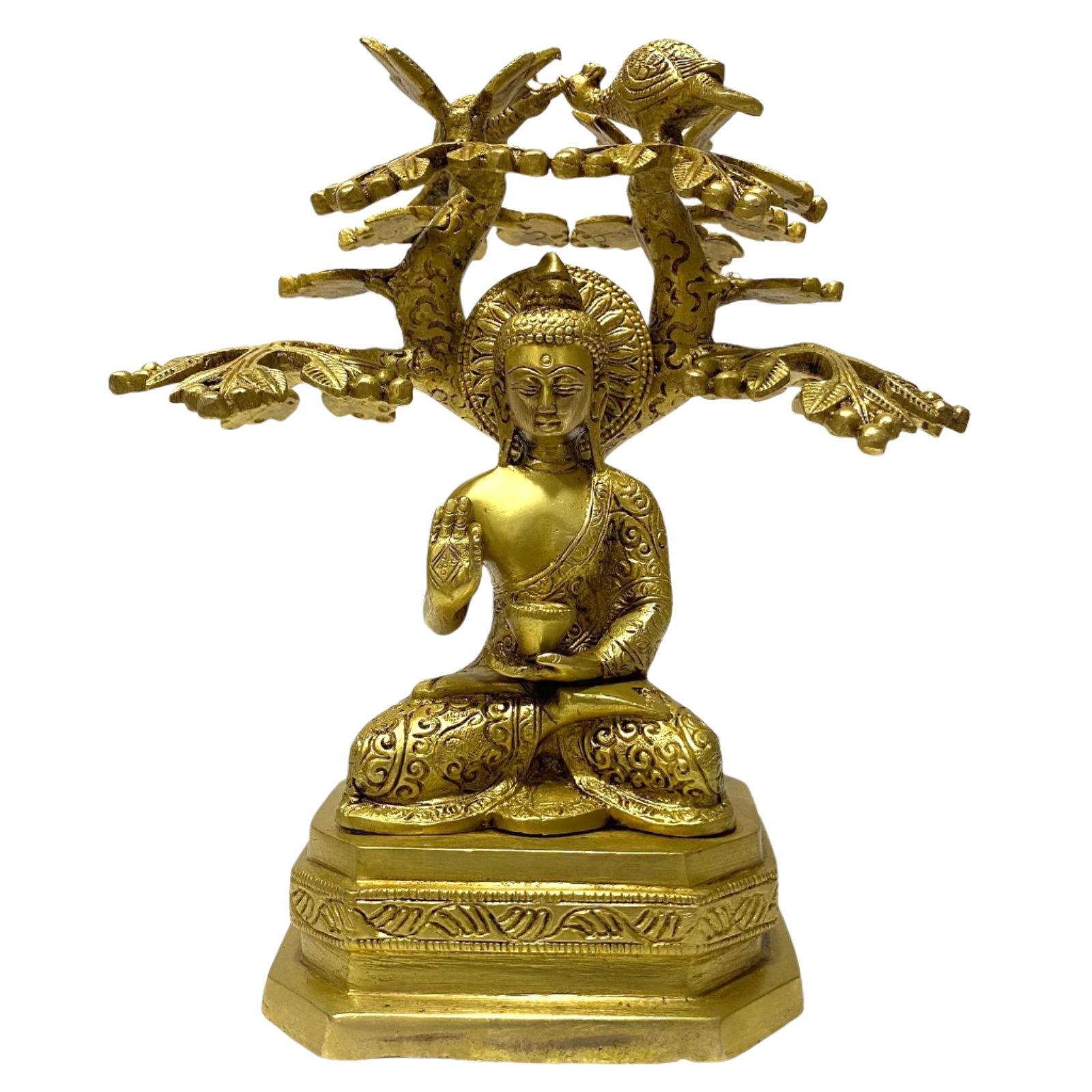 Gold-colored statue of a seated figure with intricate designs on a white background