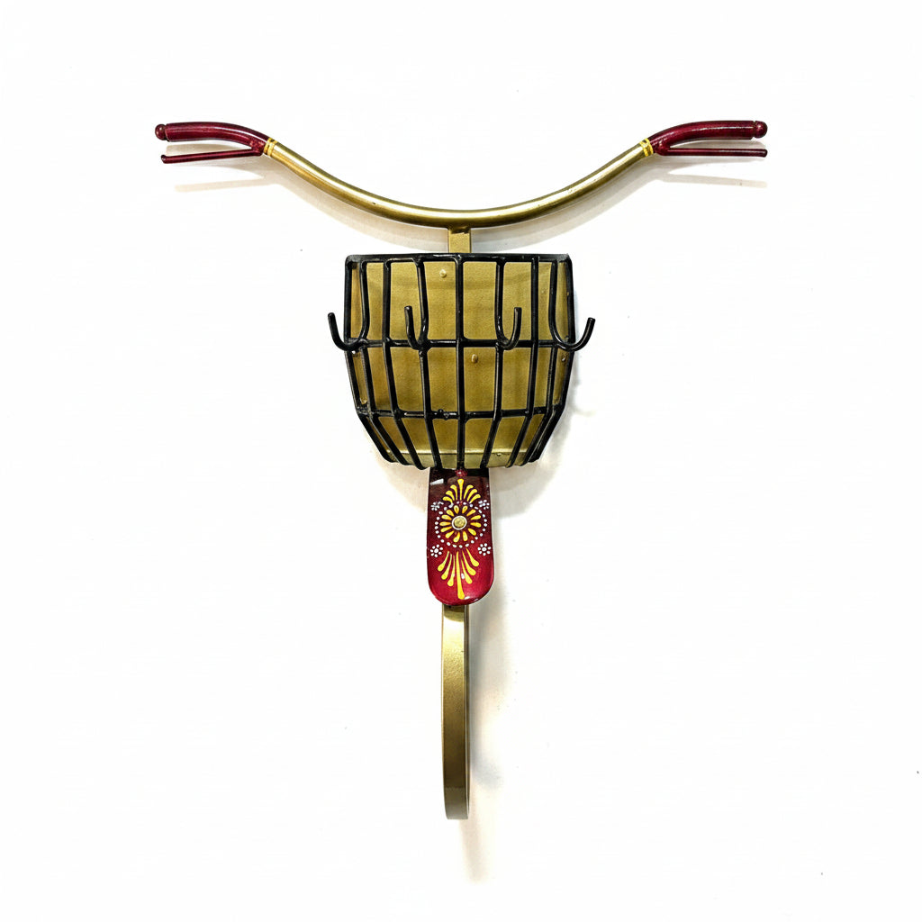 Decorative wall sconce with gold and red accents on a textured white wall.