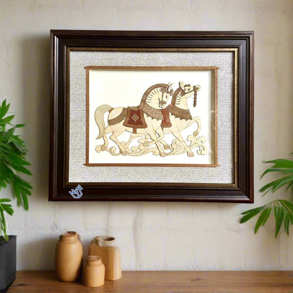 Framed artwork of two horses on a textured fabric background