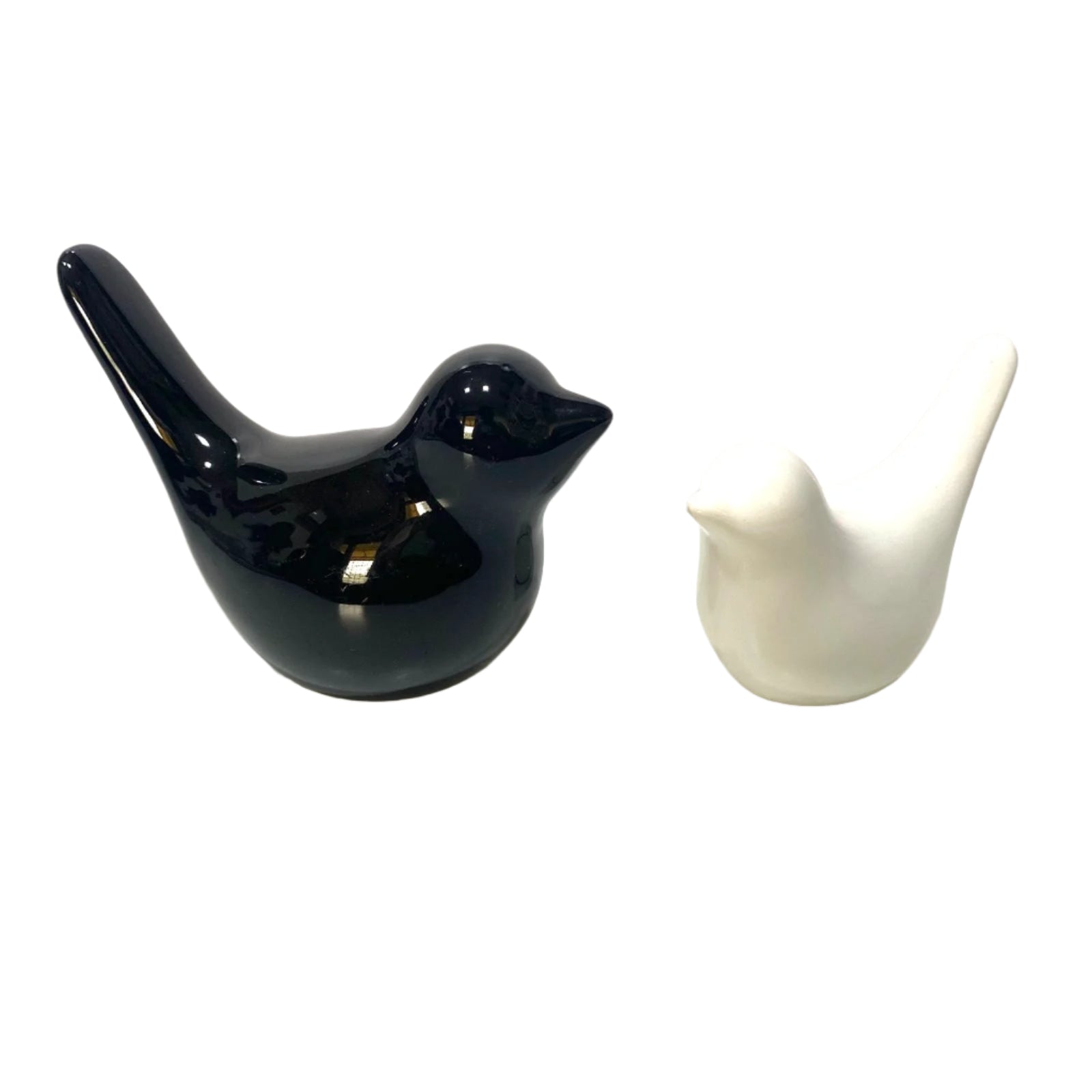 Black and white ceramic bird figurines on a light background