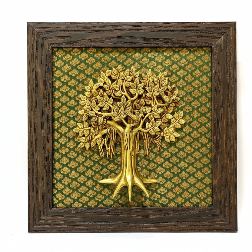 Decorative wall art with a gold tree on a patterned green background, framed in wood.
