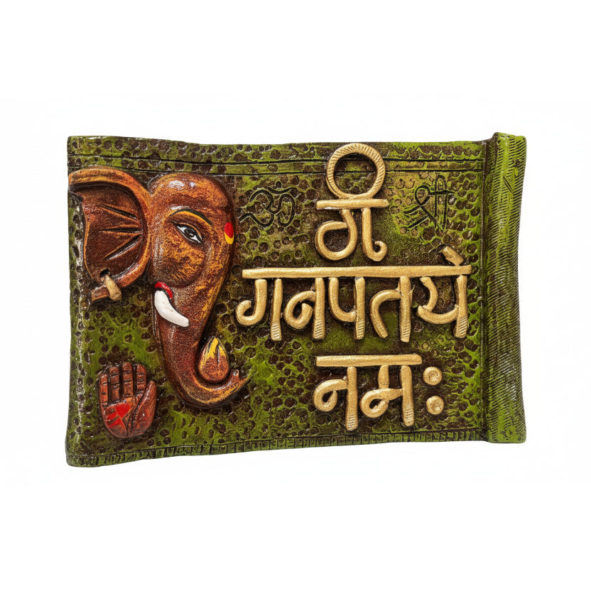 Decorative plaque with an elephant head and 'Ganpati' text on a green background
