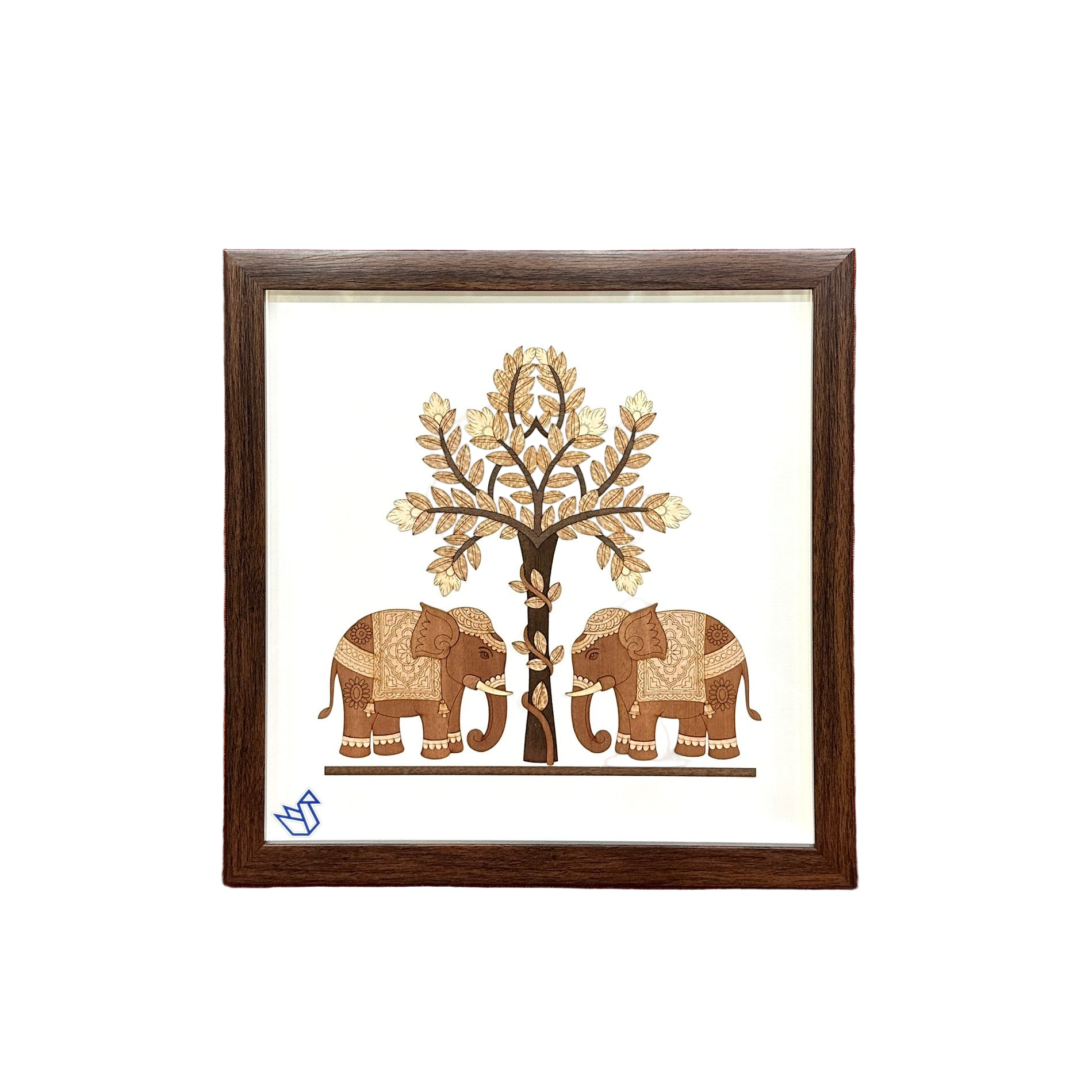 Framed artwork of two elephants and a tree on a red couch.
