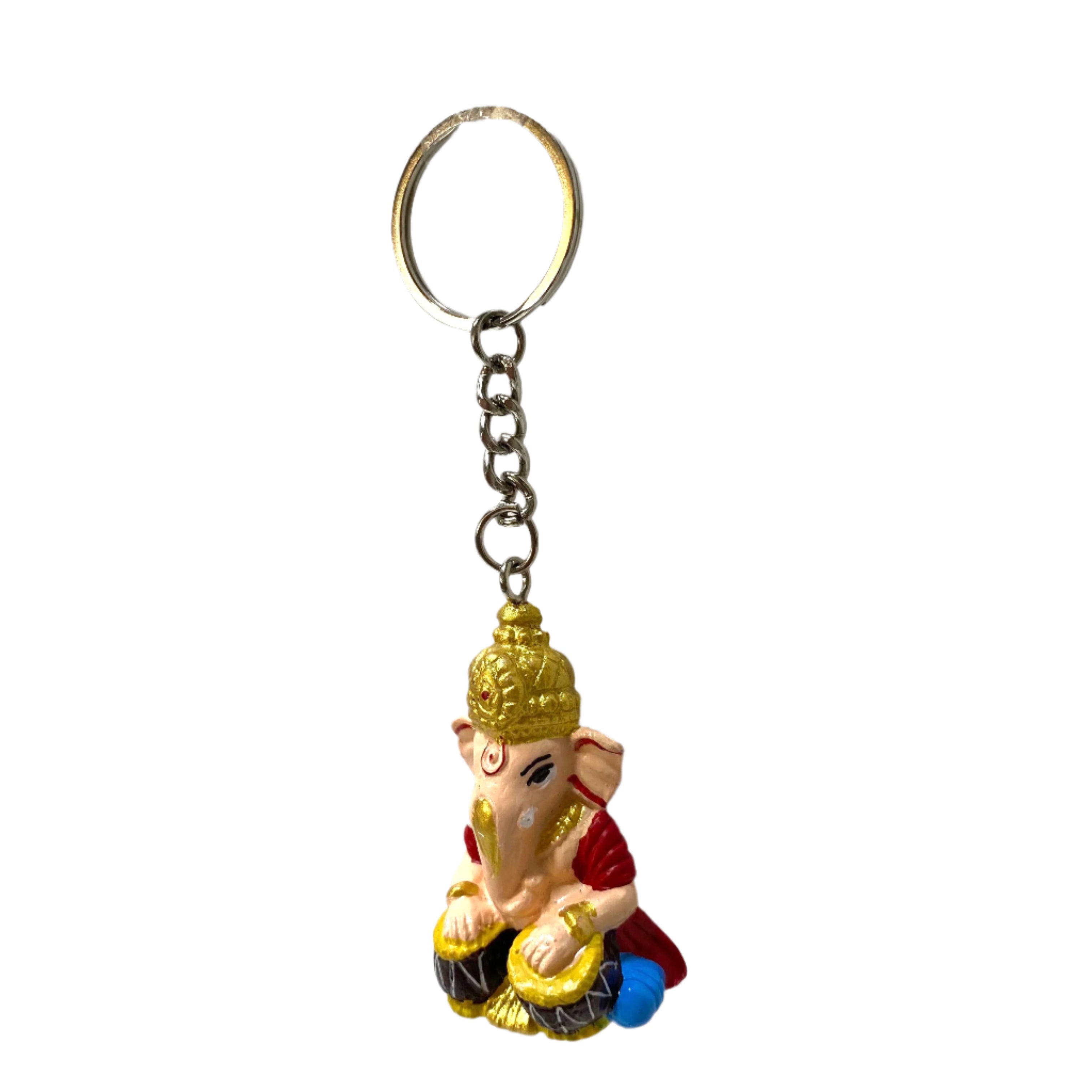 Keychain with a colorful figurine of a deity on a white textured background