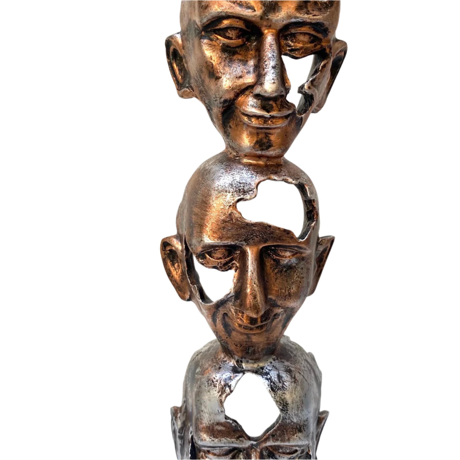 Bronze sculpture of three stacked faces on a white background