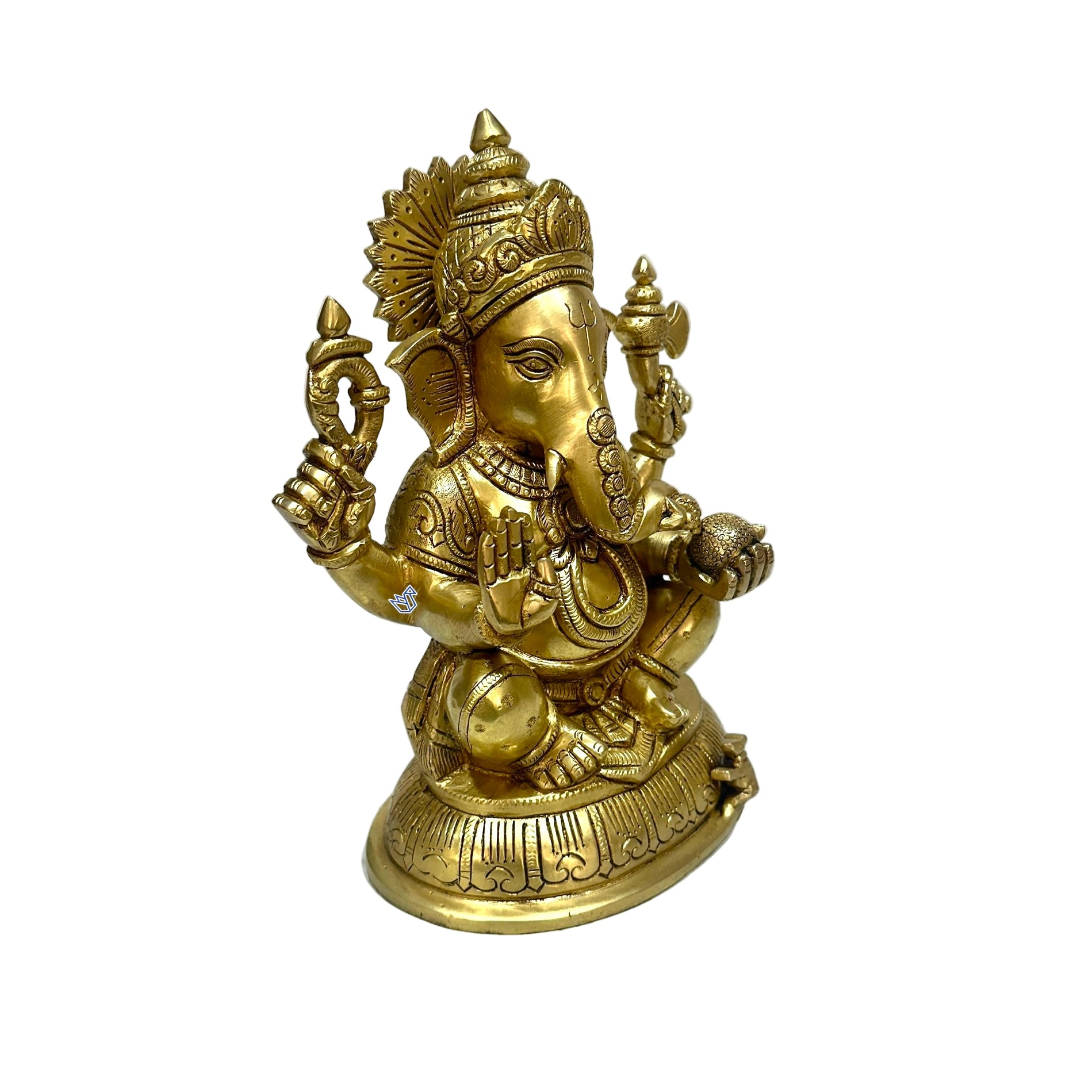 Gold-colored statue of a deity on a white surface