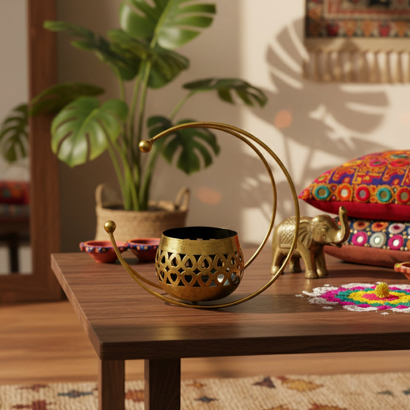 Decorative brass holder with a black interior on a white background