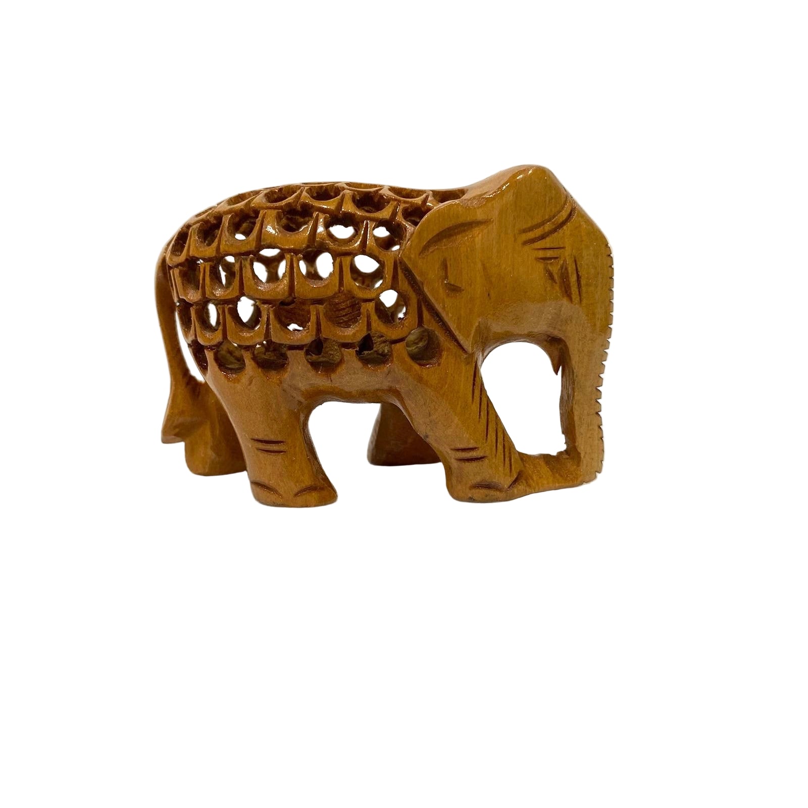 Wooden elephant figurine with intricate cut-out design on a textured white background