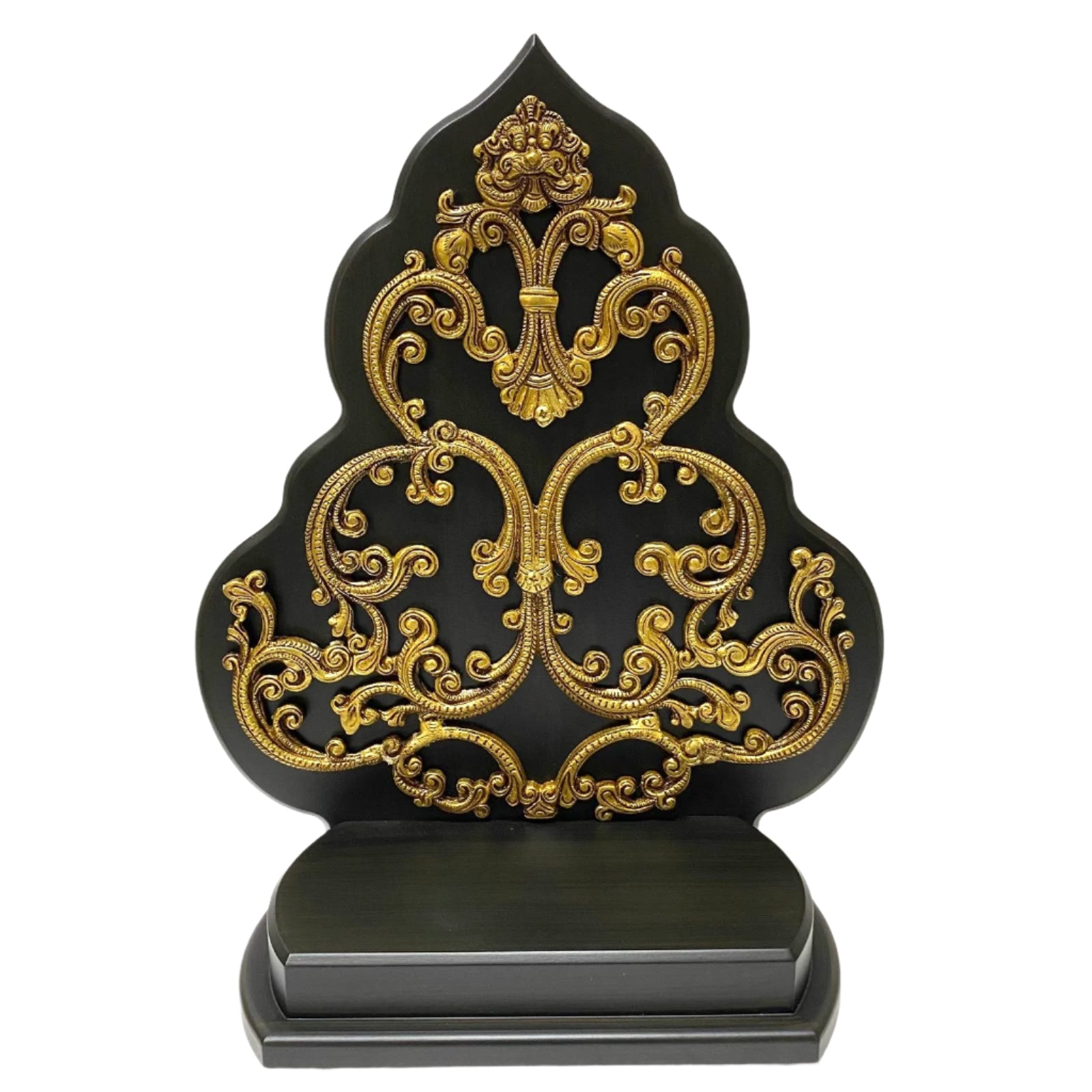 Decorative black and gold ornate object on a white background