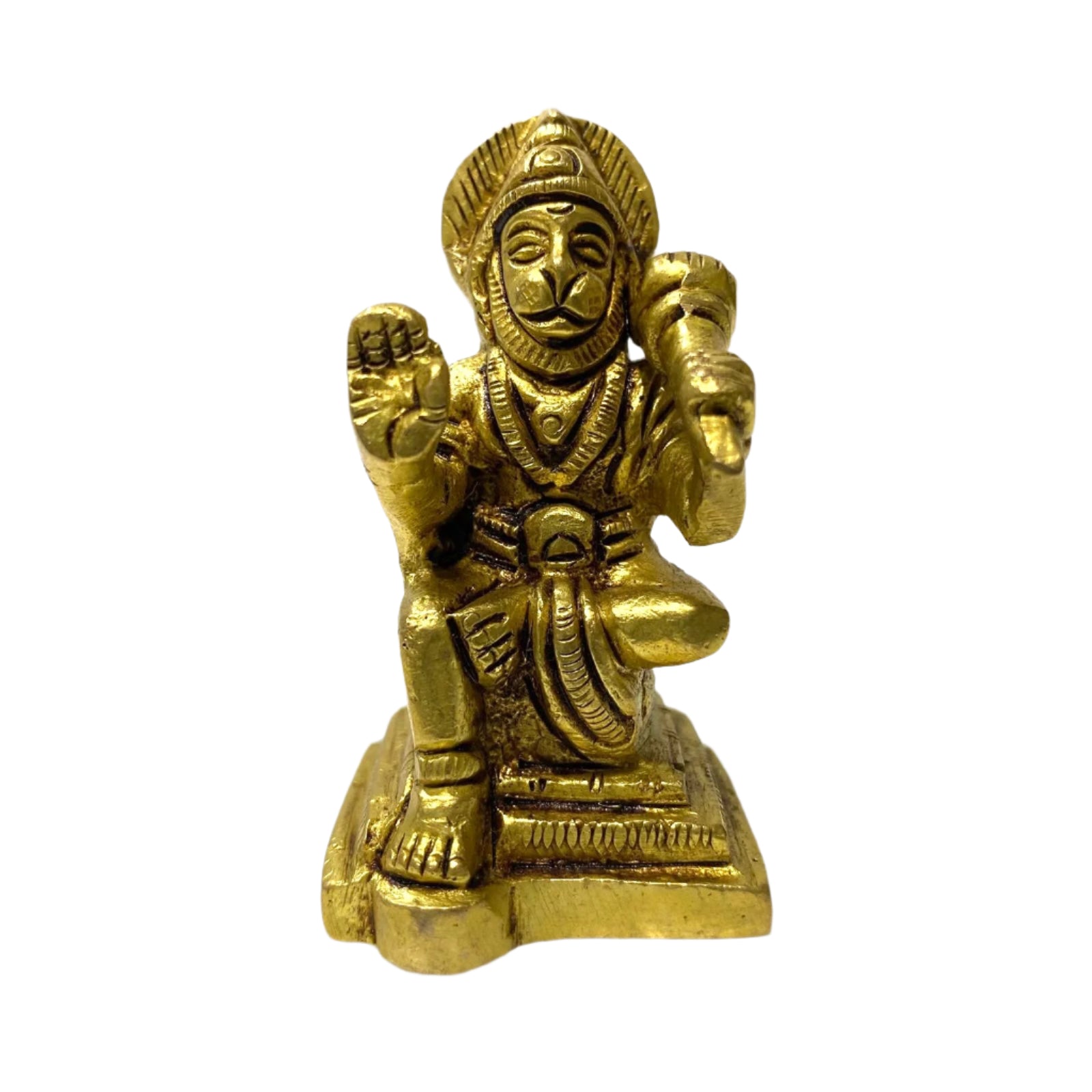 Gold-colored statue of a seated figure on a white background