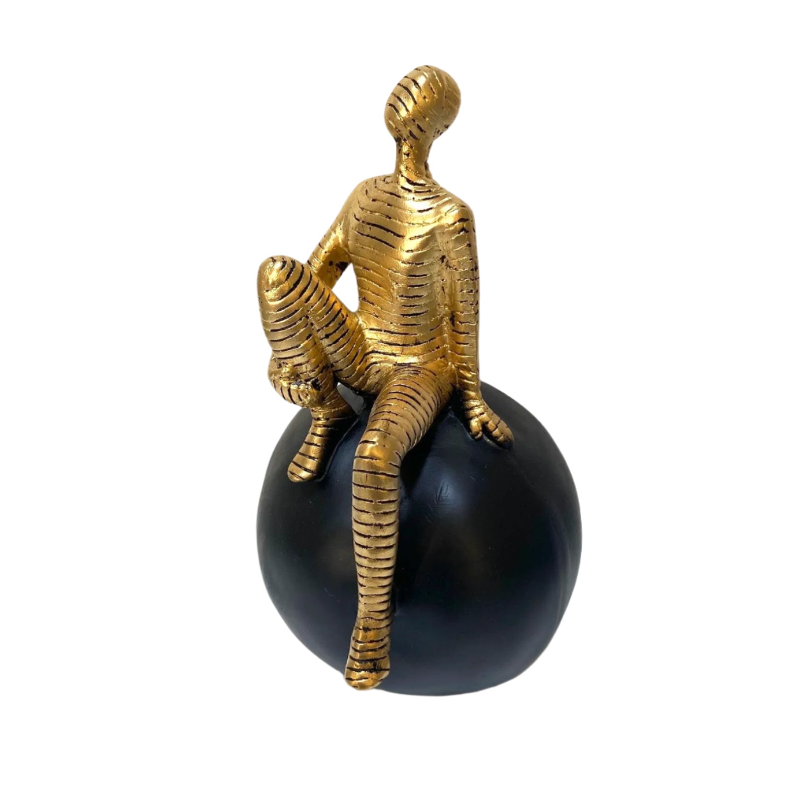 Bronze sculpture of a figure with a zebra on a black sphere against a white background