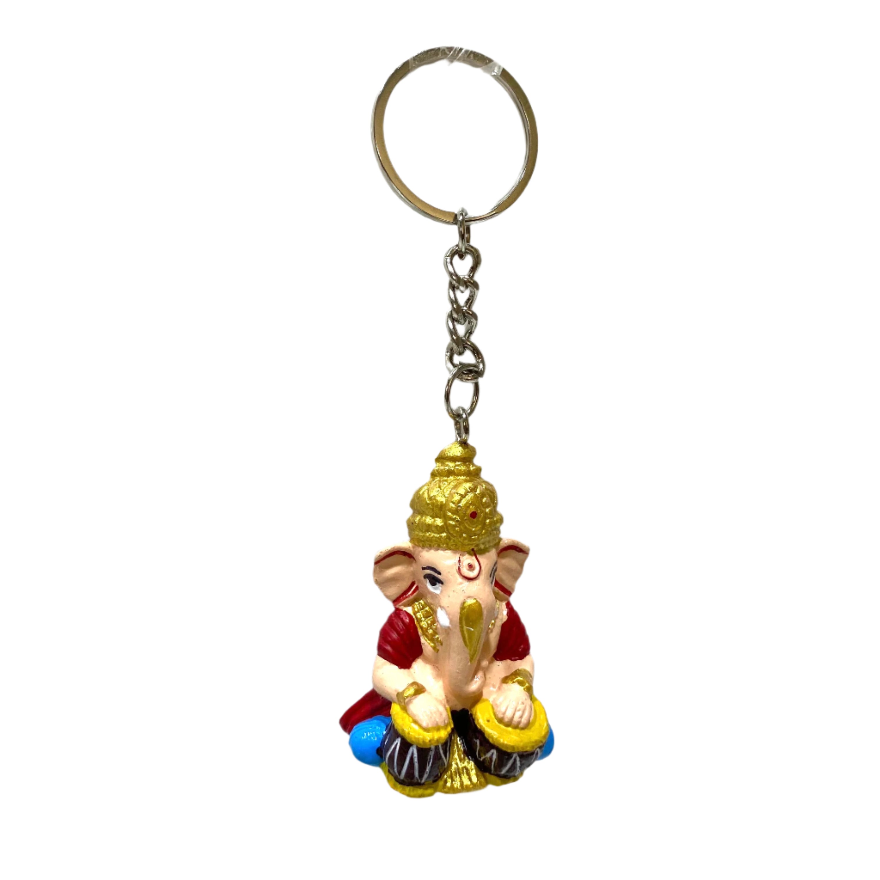 Keychain with a small statue of a deity on a white textured background