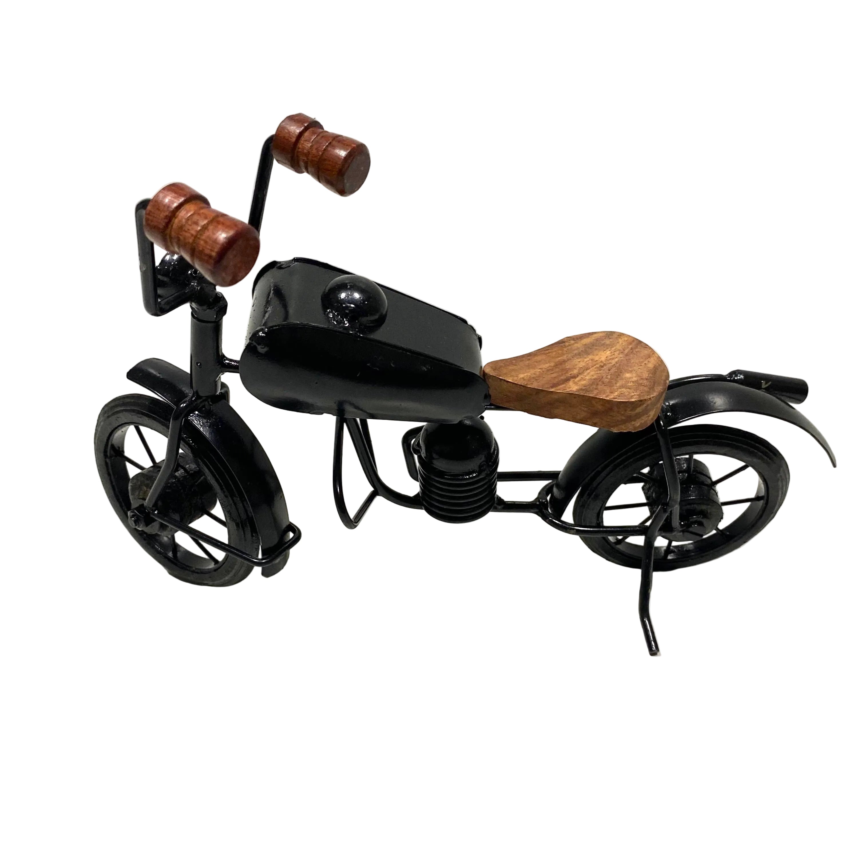 Small black metal motorcycle model with wooden handlebars and seat on a white background