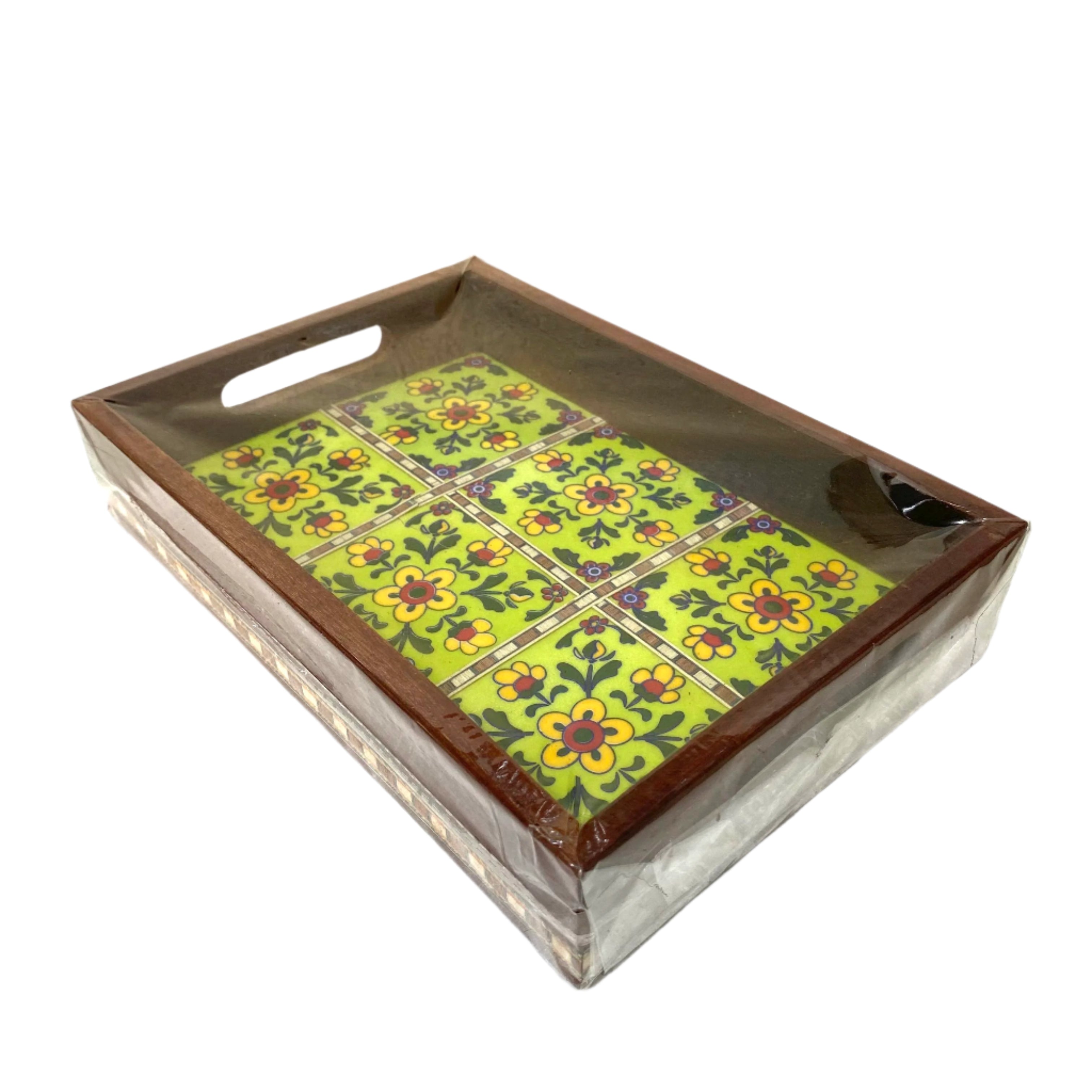 Decorative tray with floral tile pattern on a white surface
