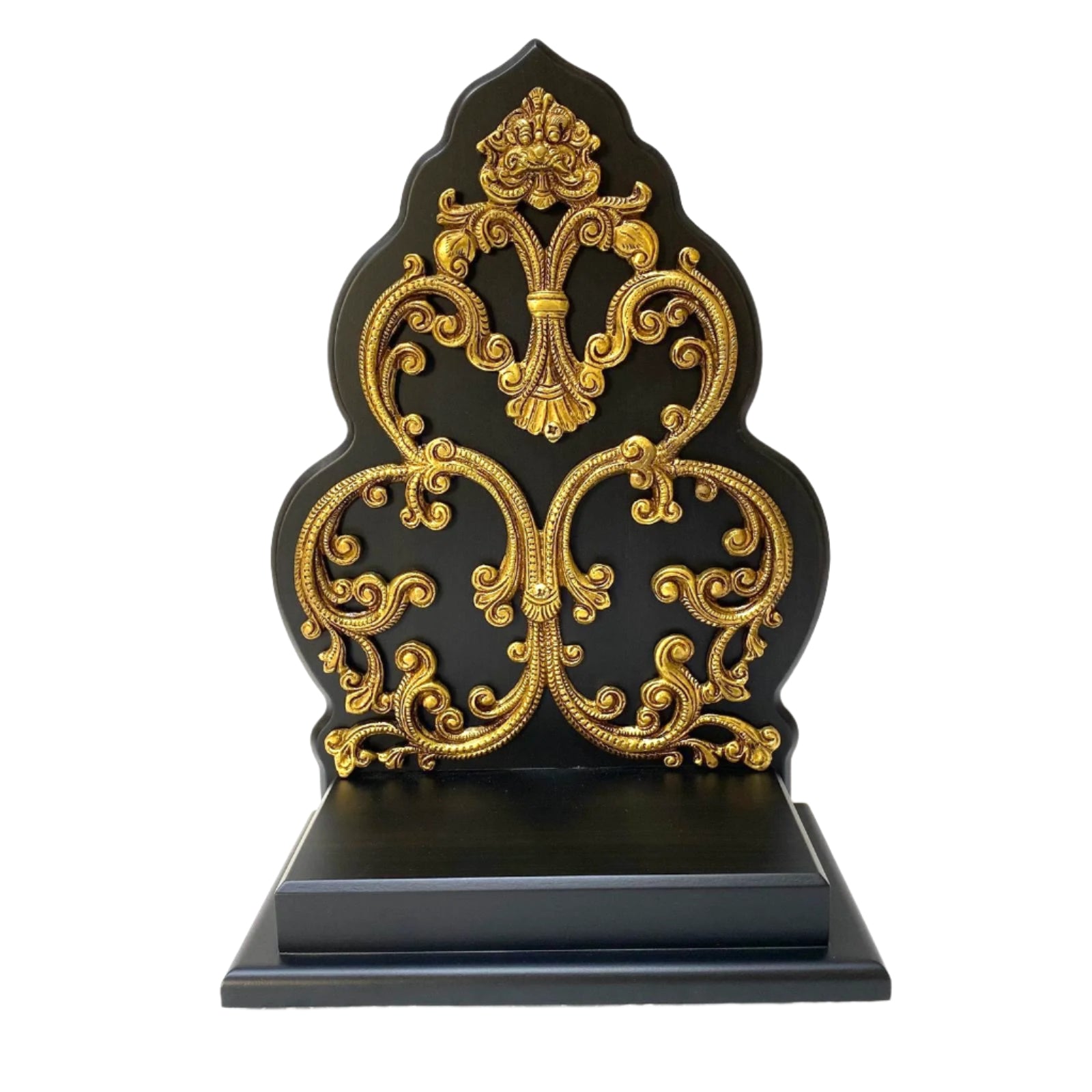 Decorative black and gold bookend with intricate designs on a white background