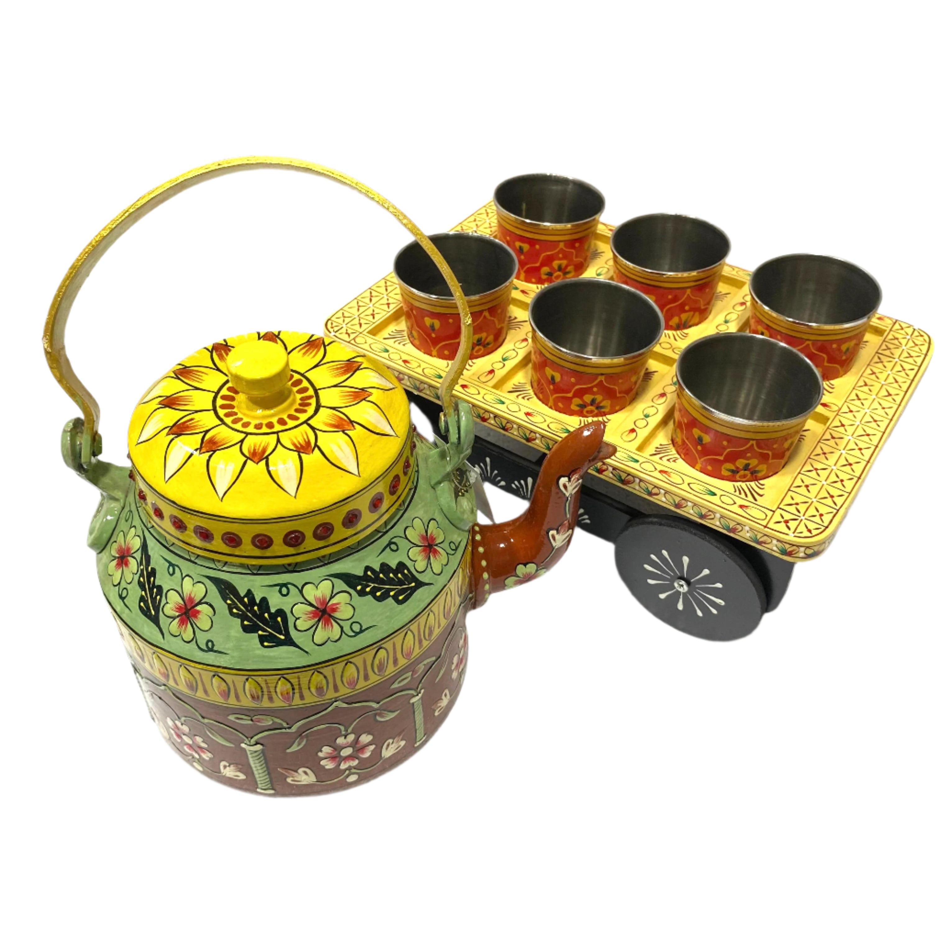 Decorative teapot set with cups and tray on a white background