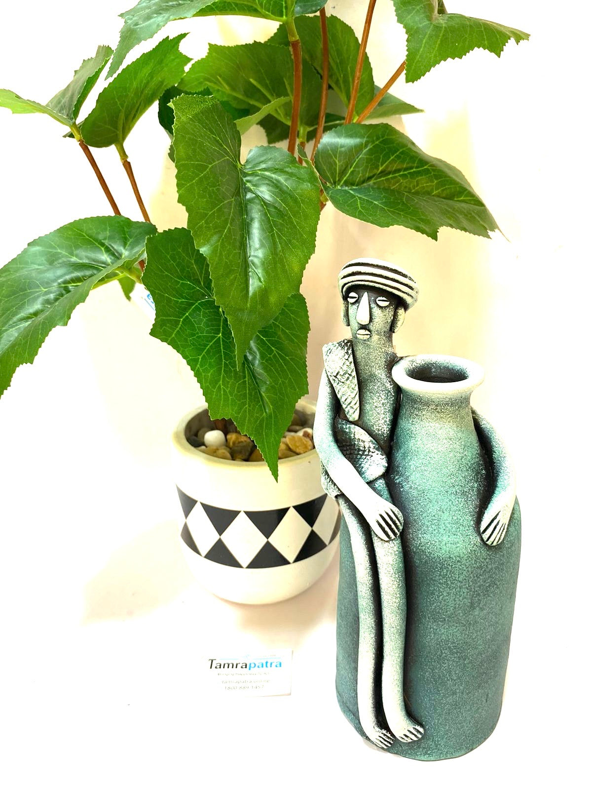 Tribal Man Sitting on Colorful Pot Exclusive Pottery Decoration By Tamrapatra - Tamrapatra