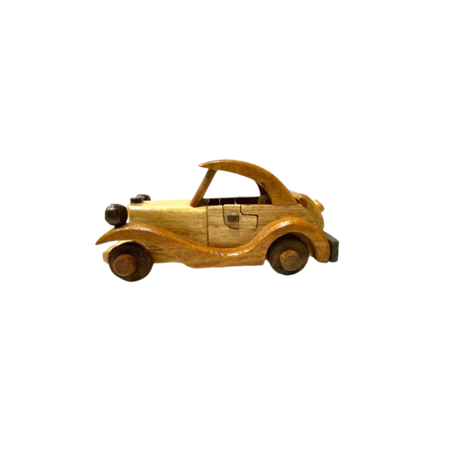Wooden toy car on a white surface with a light gray background