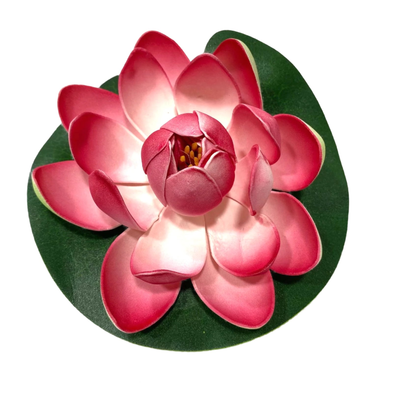 Pink artificial flower on a green base with a white background