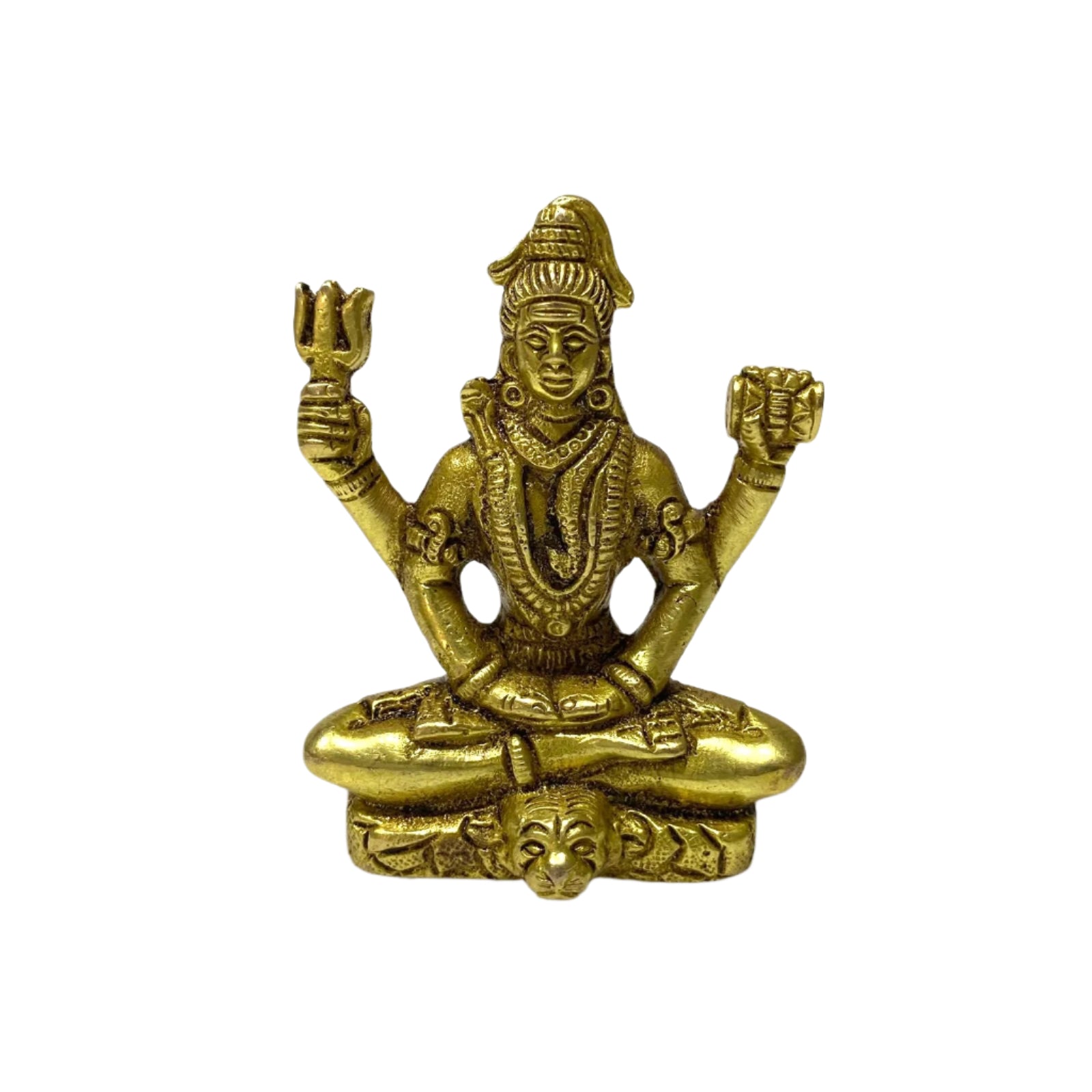 Brass statue of a seated figure on a white background