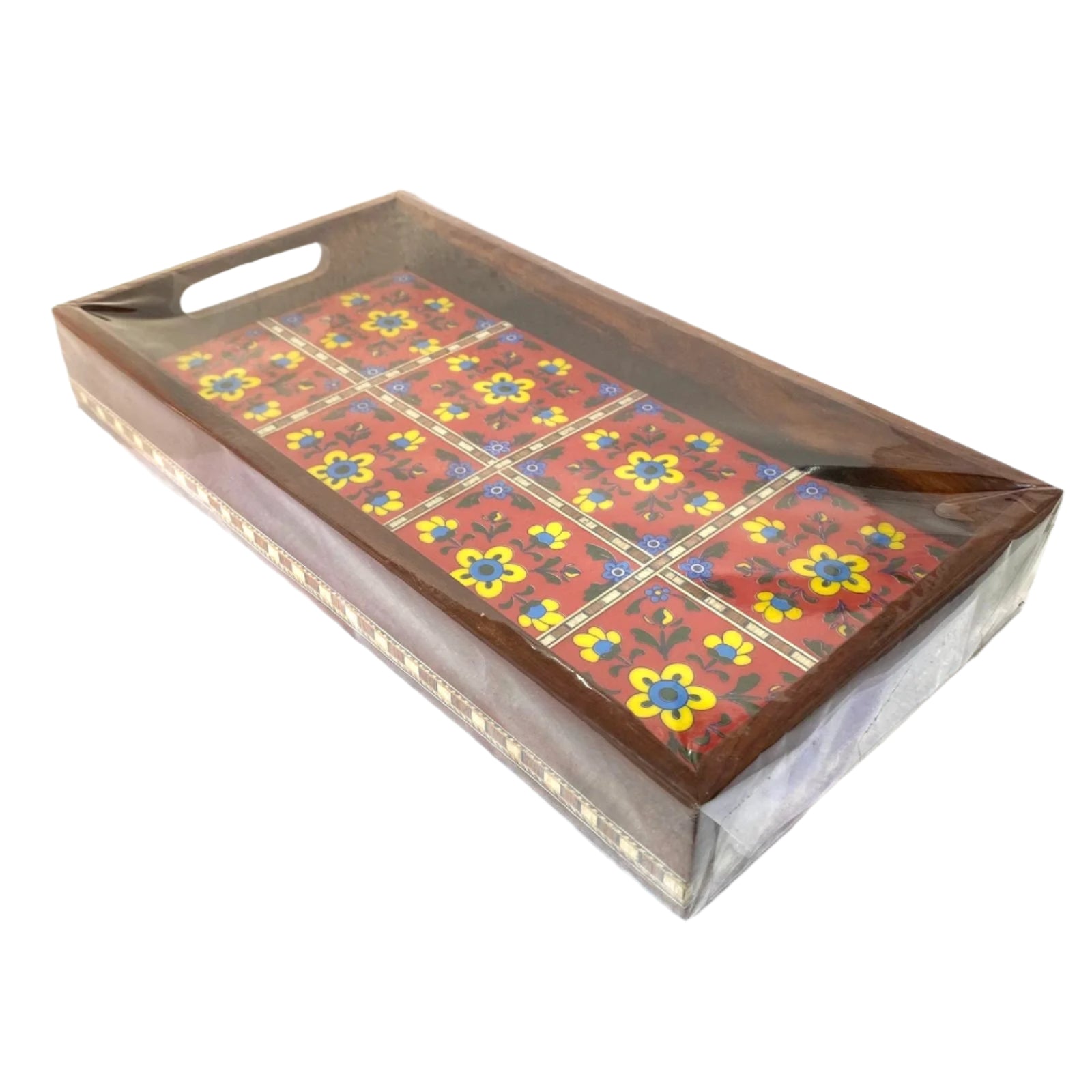 Decorative tray with floral patterns on a white surface