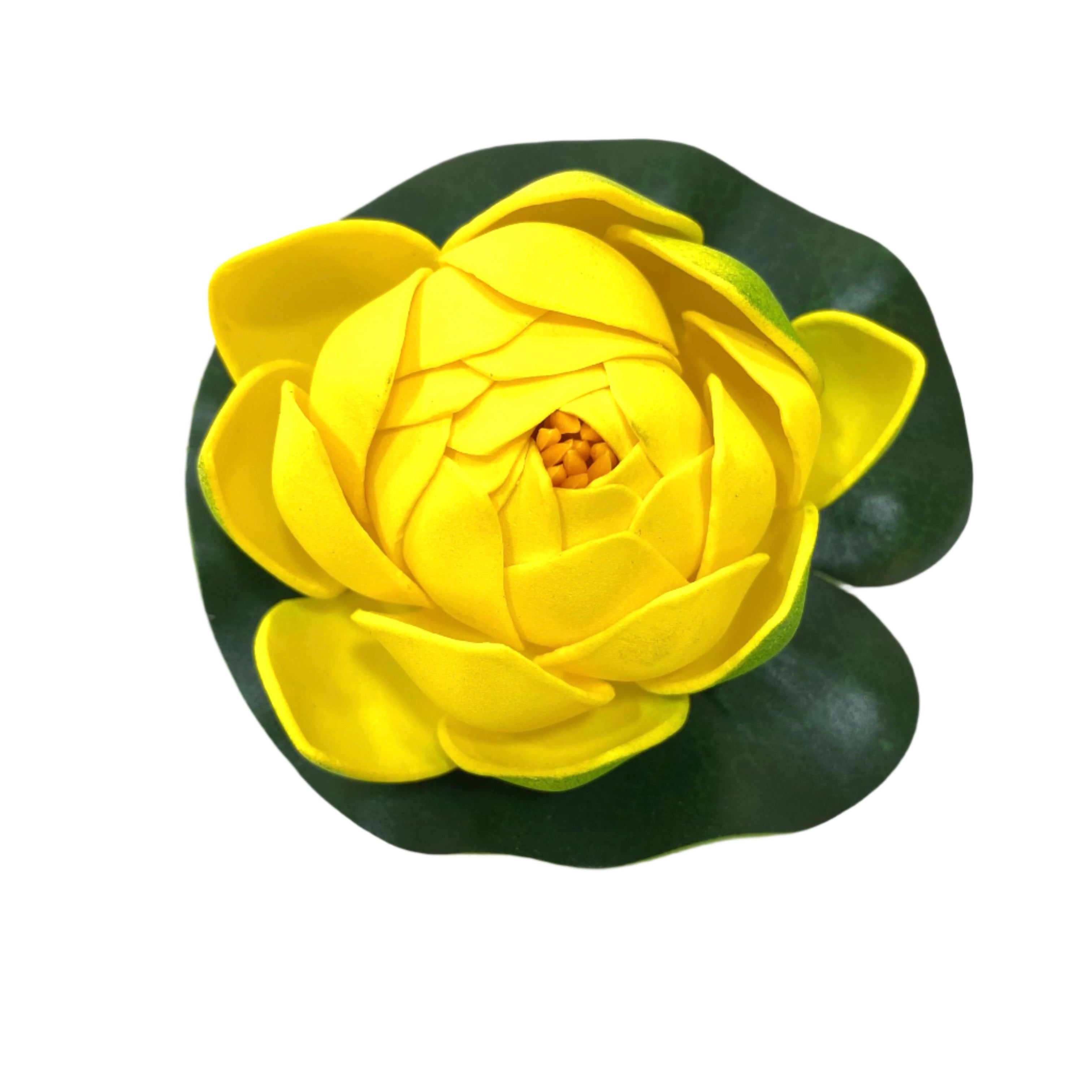 Yellow artificial water lily flower with green leaves on a white background