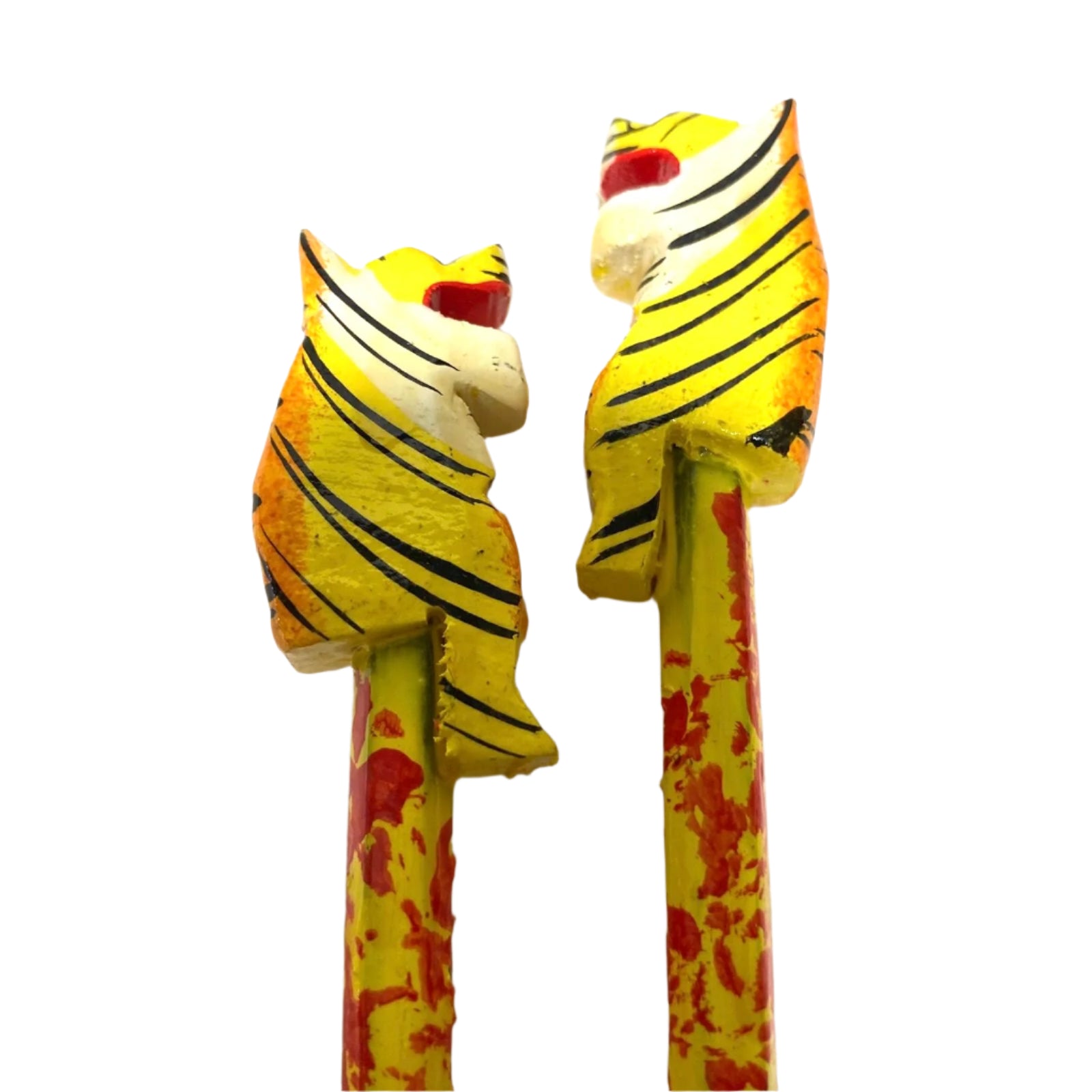 Two wooden tiger figurines with a zebra stripe pattern on a white background