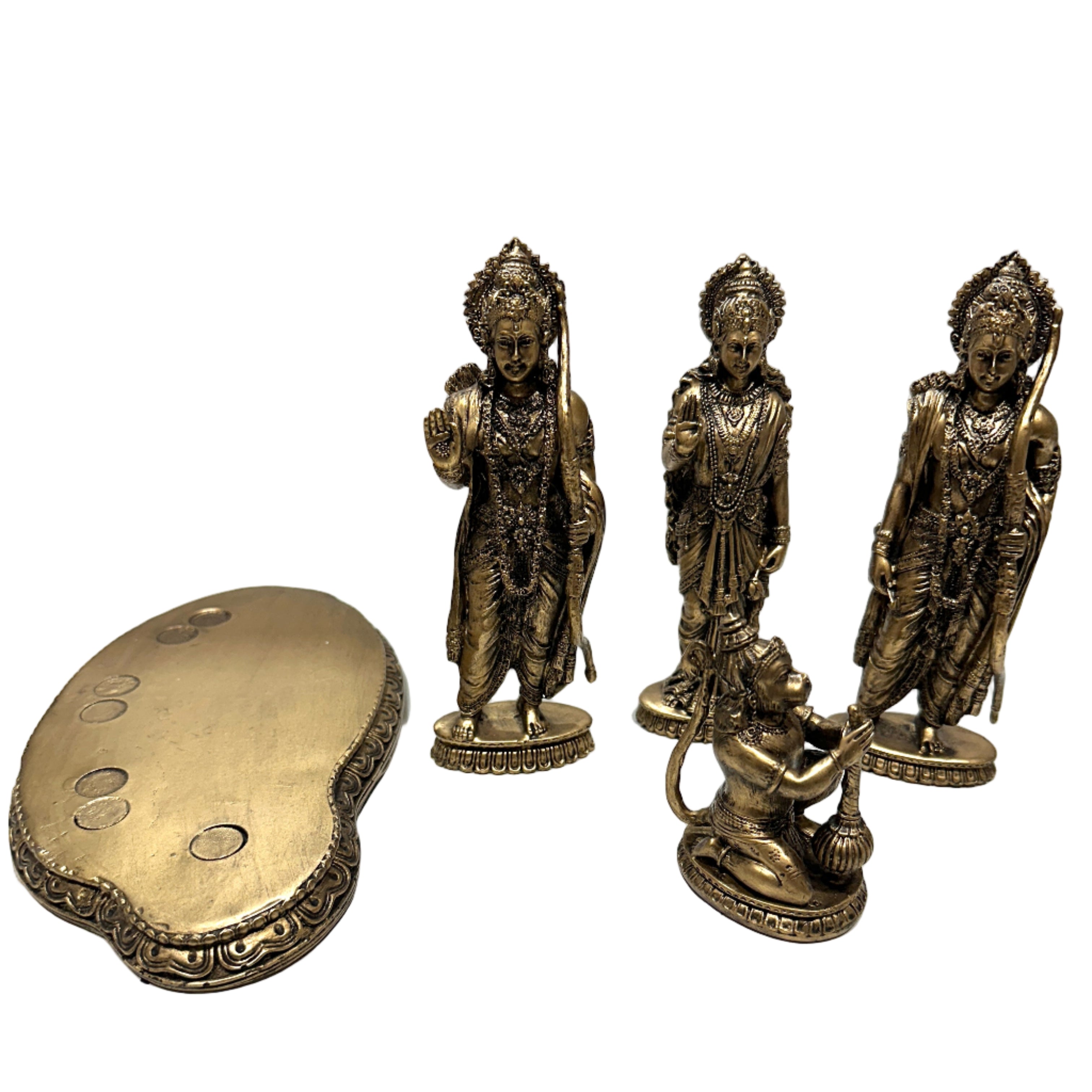 Set of four bronze statues on a white surface
