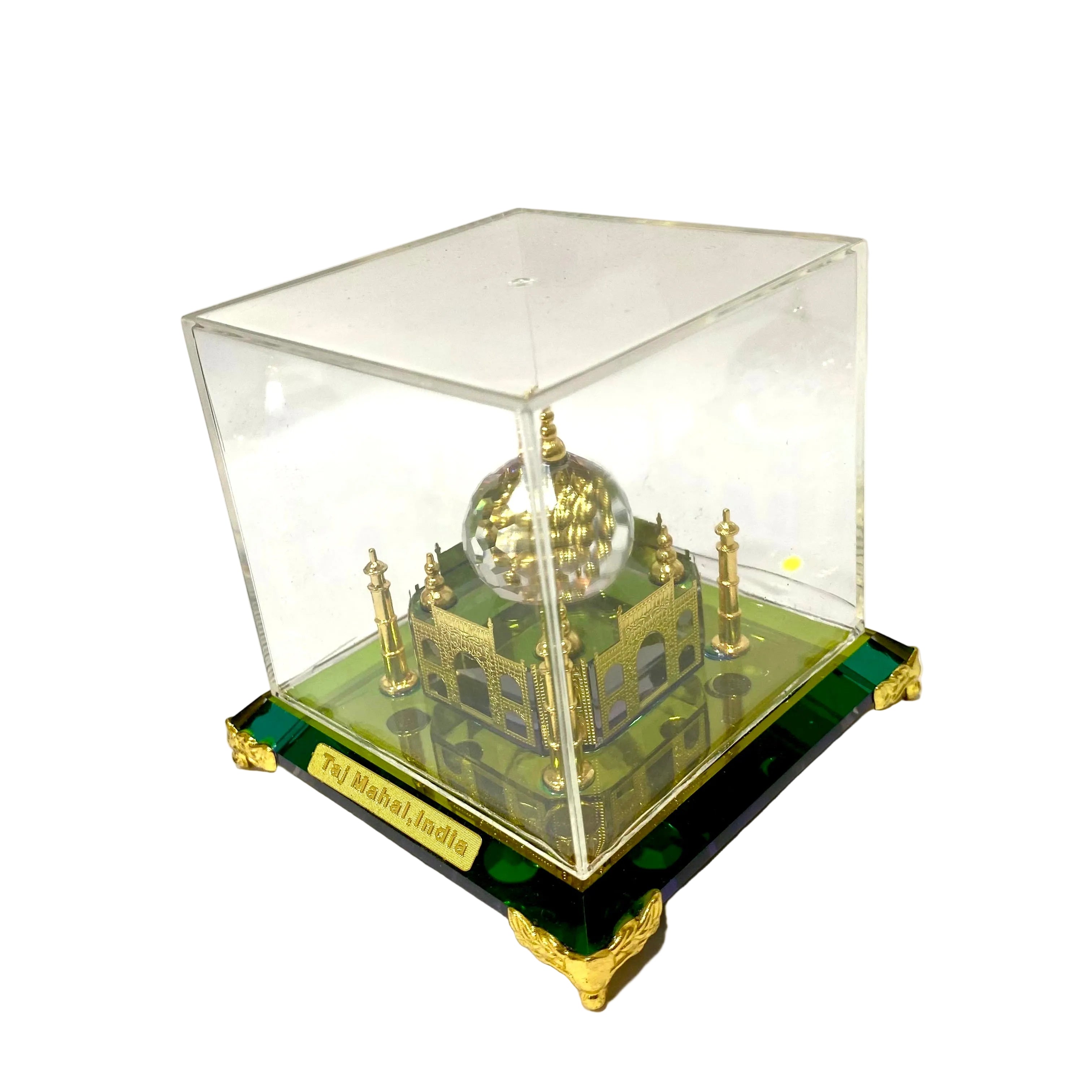 Model of a Taj Mahal replica in a clear display case on a white background