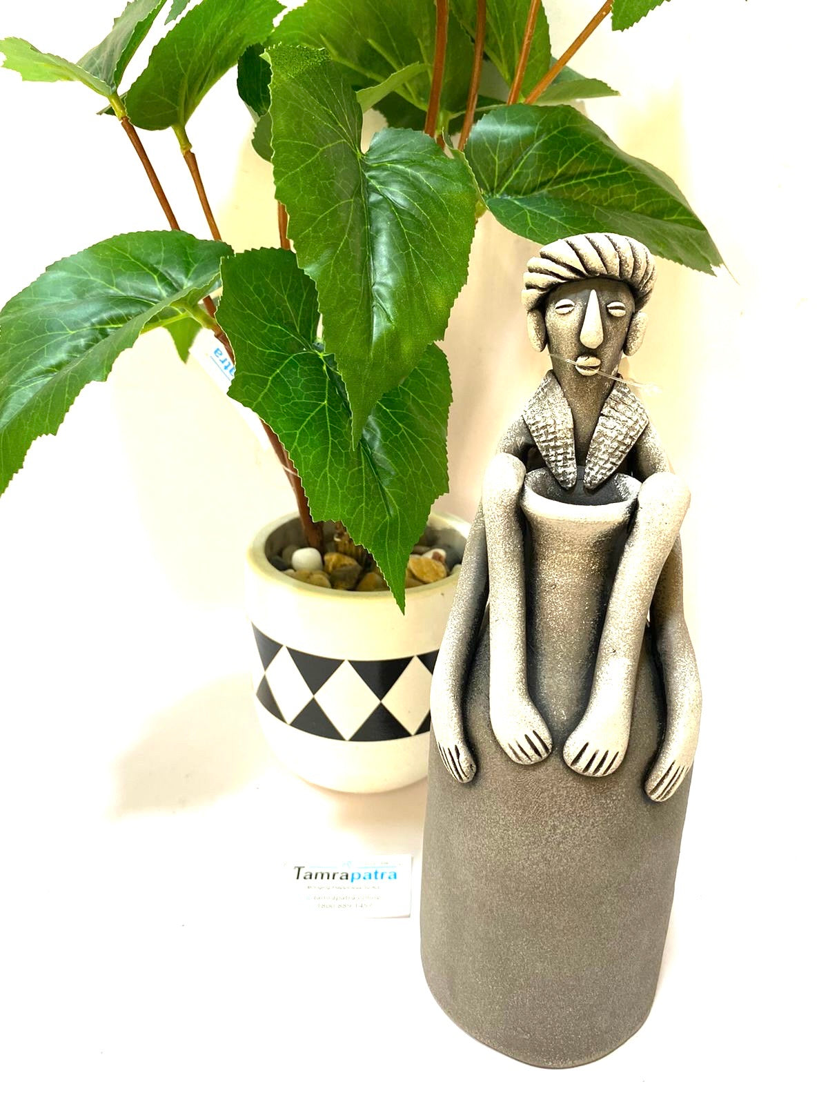 Tribal Man Sitting on Colorful Pot Exclusive Pottery Decoration By Tamrapatra - Tamrapatra
