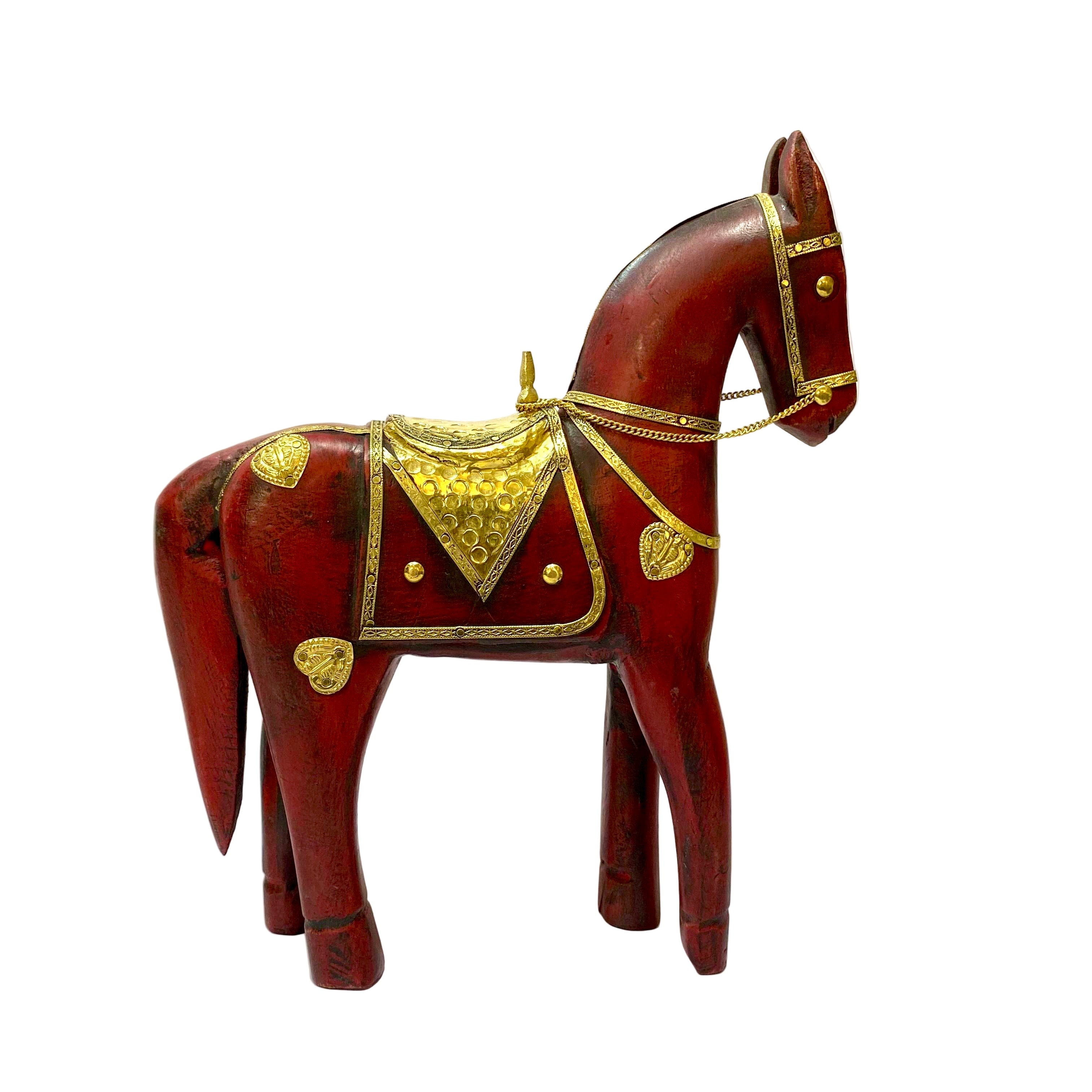 Wooden horse figurine with gold accents on a white surface