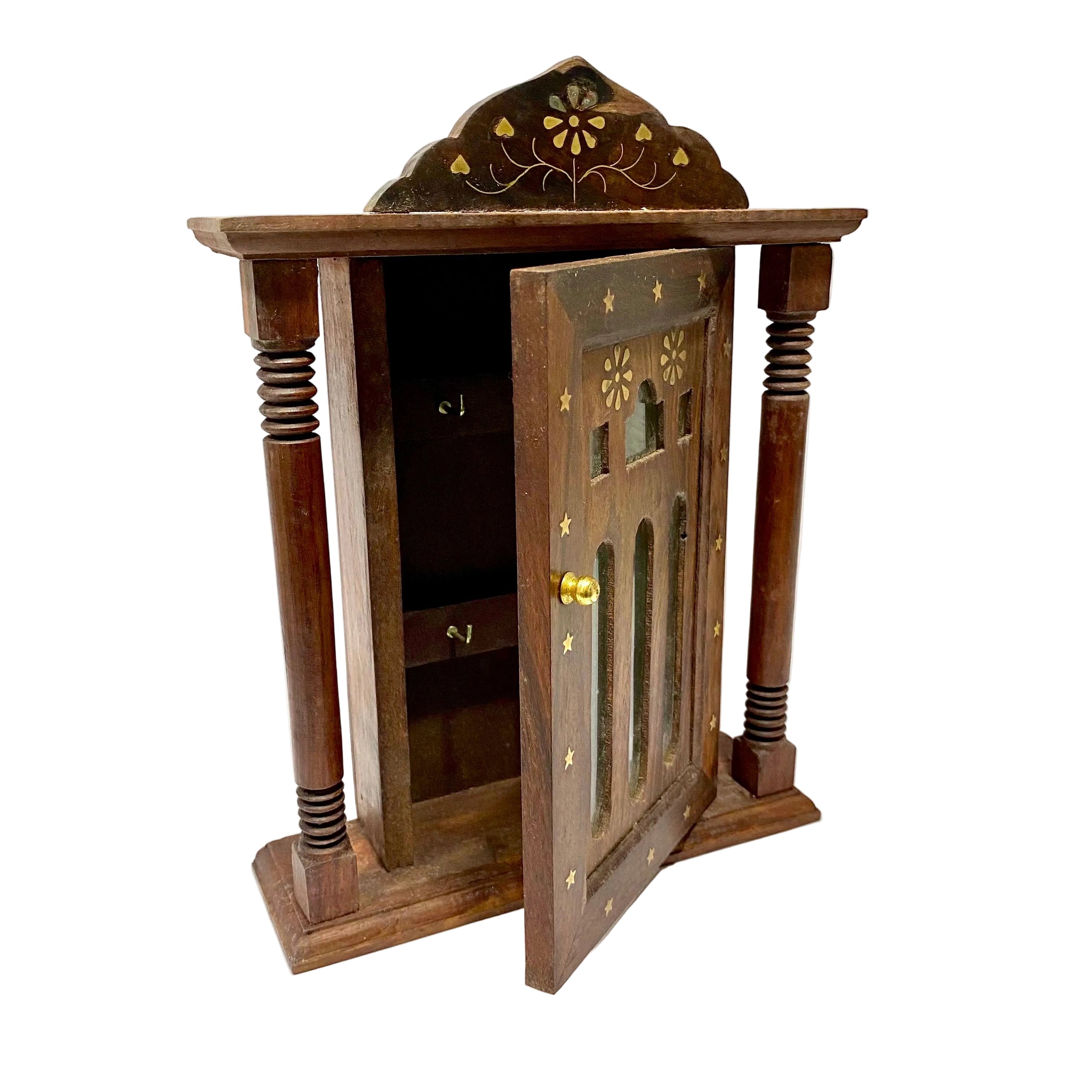 Wooden cabinet with decorative design on a white background