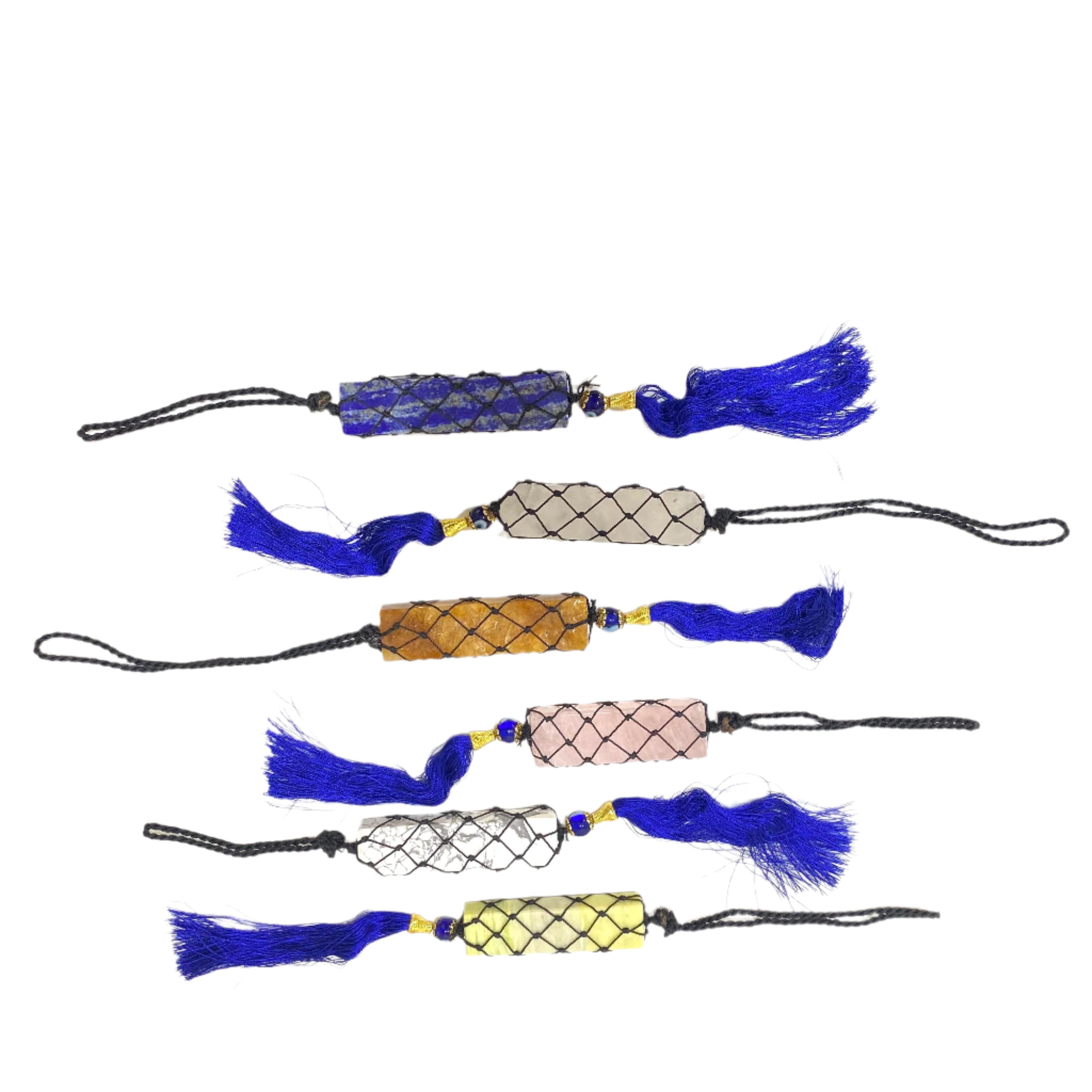 Collection of decorative tassels on a white surface