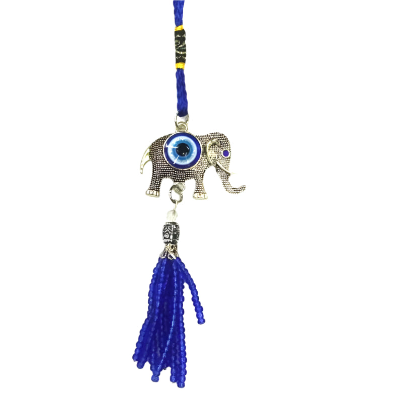 A silver-colored car hanging with an eye pattern and a blue tassel, featuring a small elephant figure and decorative beads.