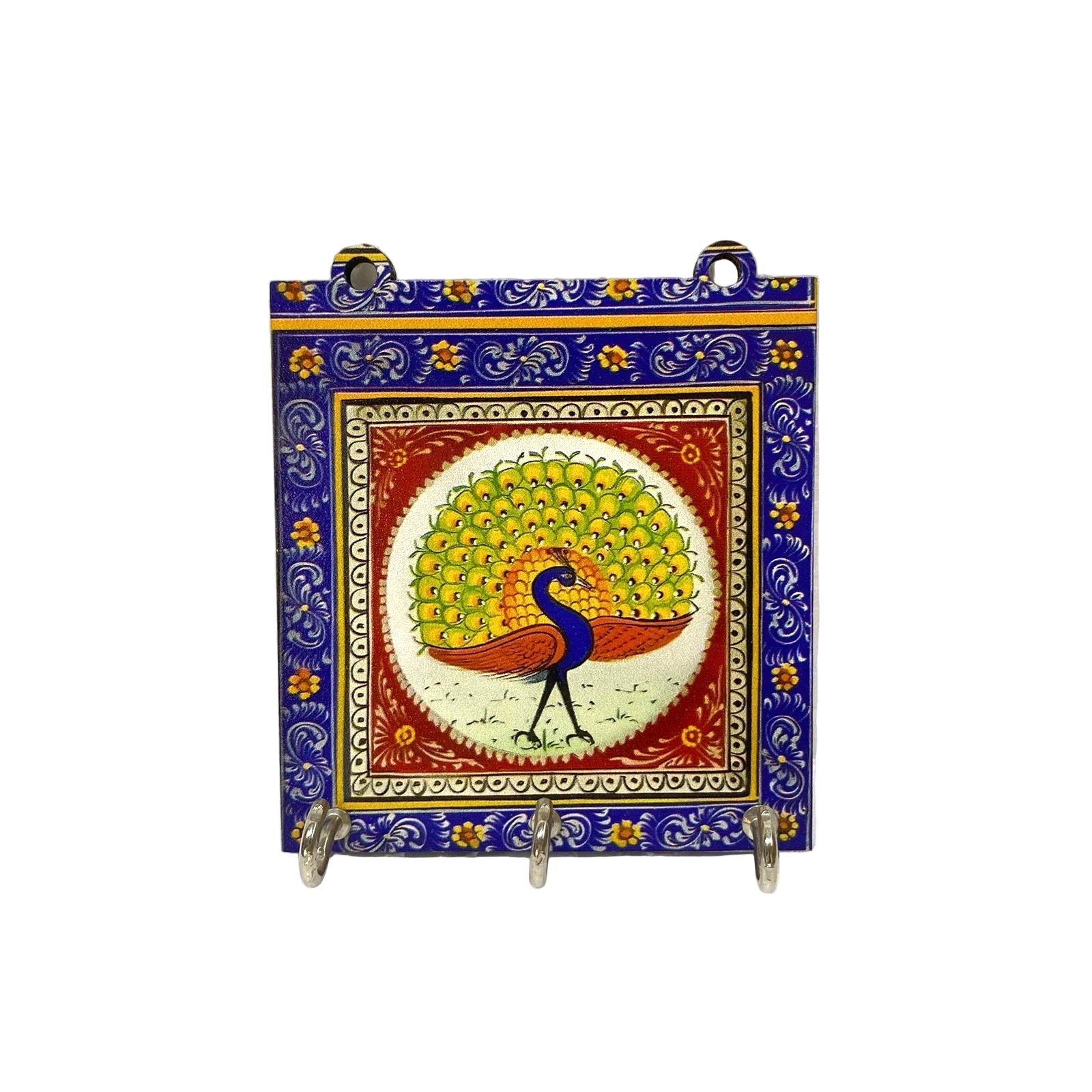 Decorative tile with a peacock design on a white background