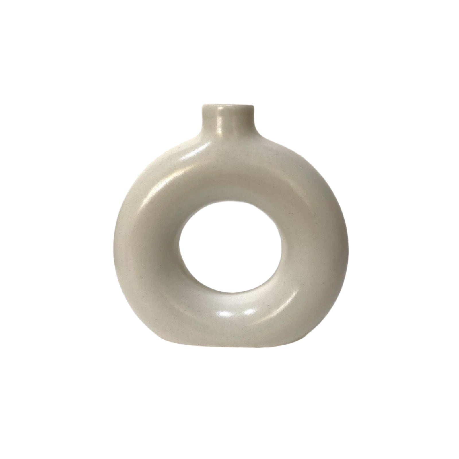 White ceramic vase with a circular hole on a white surface