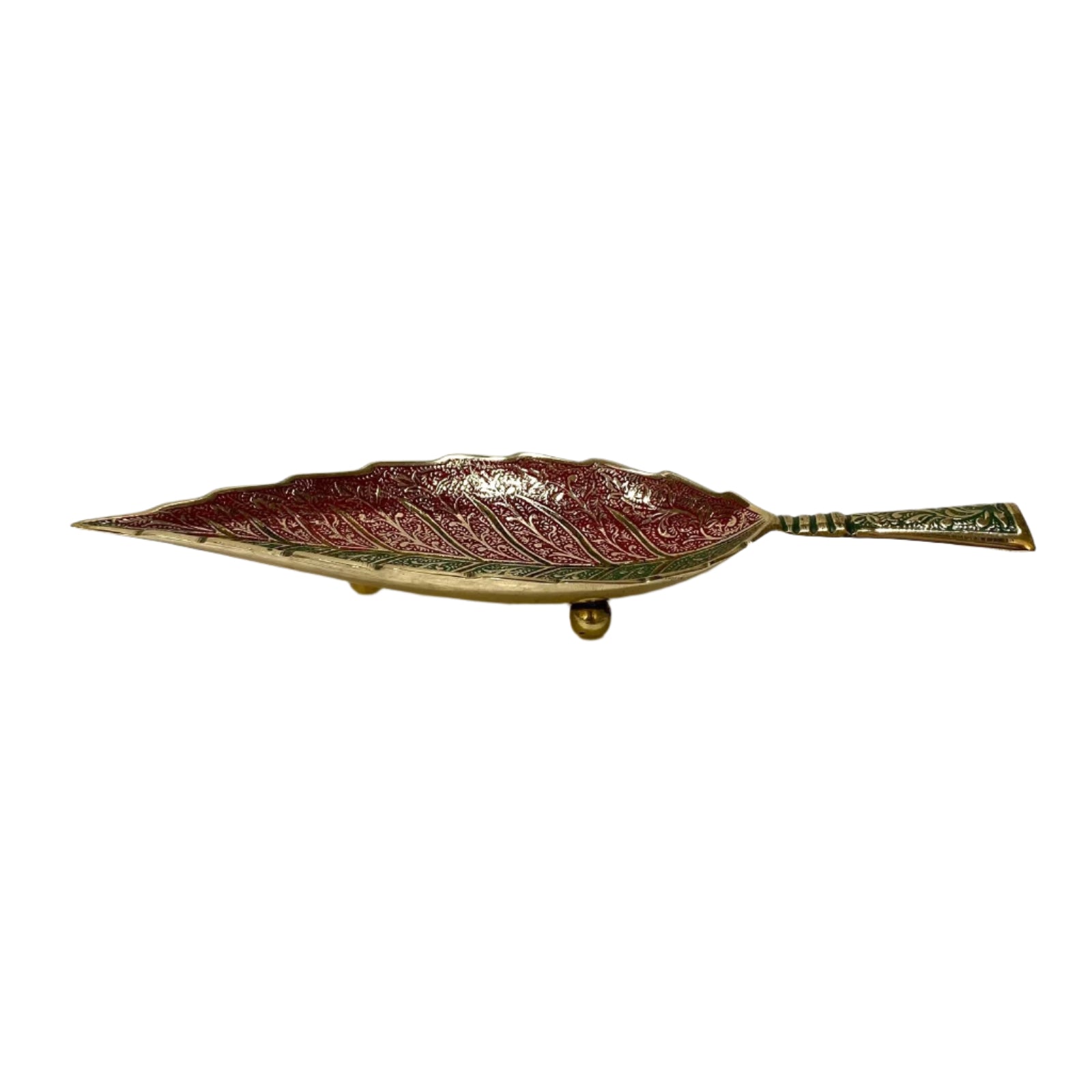 Decorative leaf-shaped tray with embossed design on a white background