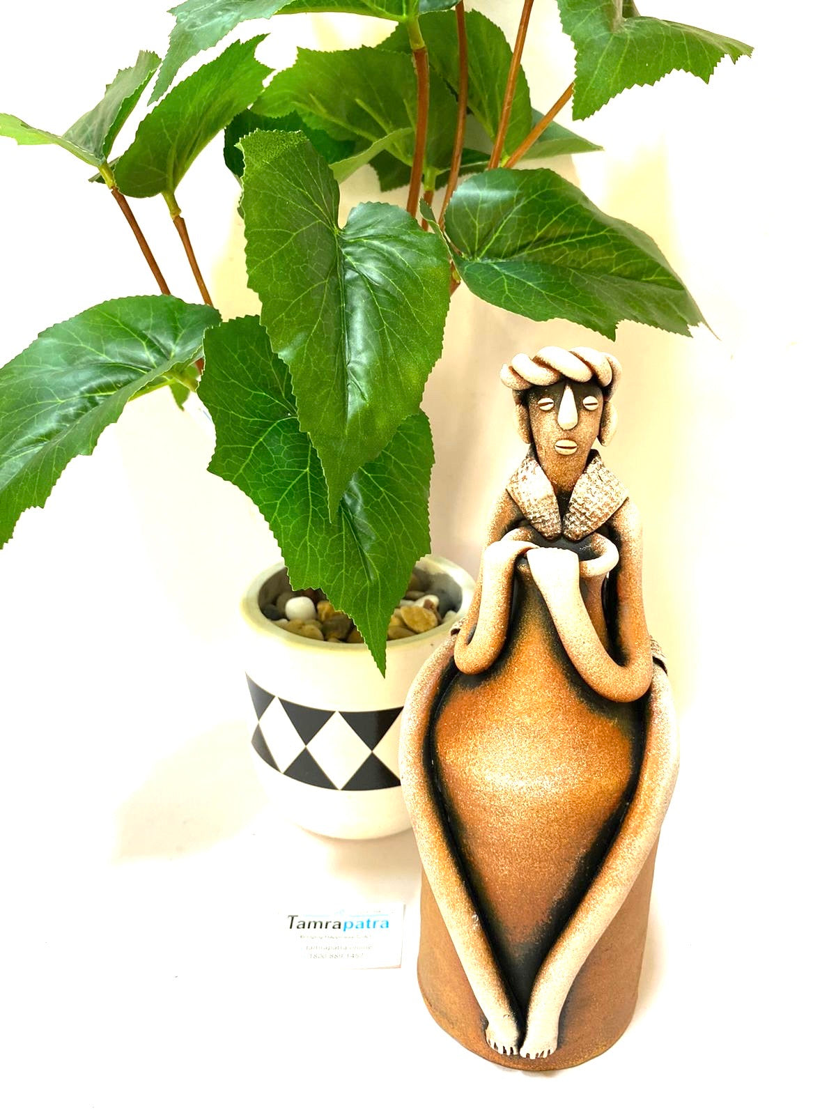 Tribal Man Sitting on Colorful Pot Exclusive Pottery Decoration By Tamrapatra - Tamrapatra
